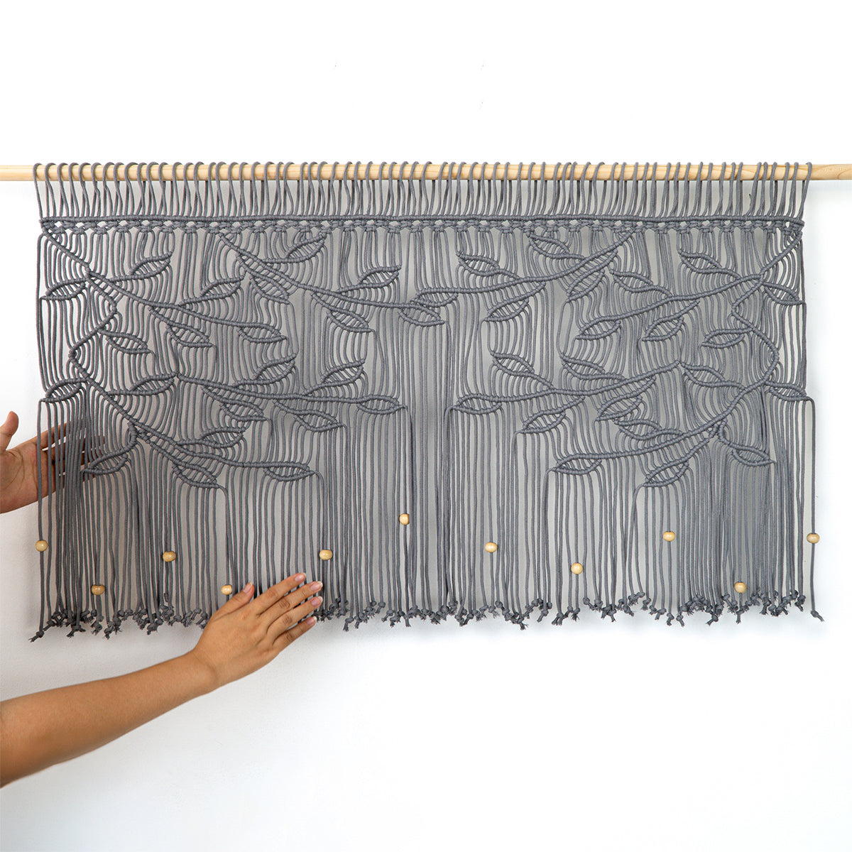 Textured fiber art in slate and charcoal tones for Scandinavian or urban loft interior design.