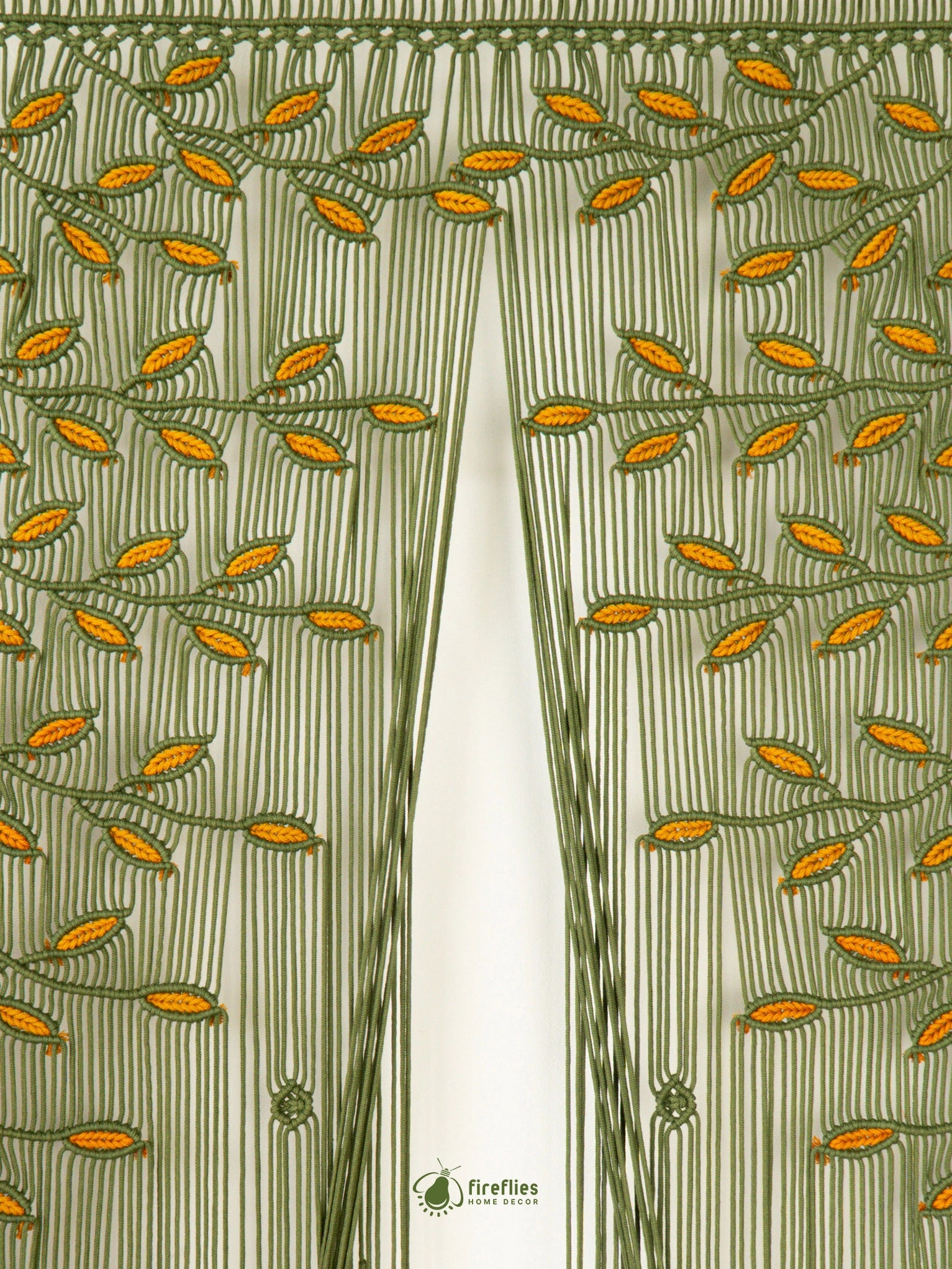 A brown and beige striped curtain panel with an embroidered tree branch and leaf pattern across the top, vertical fringe, and small tassel details.