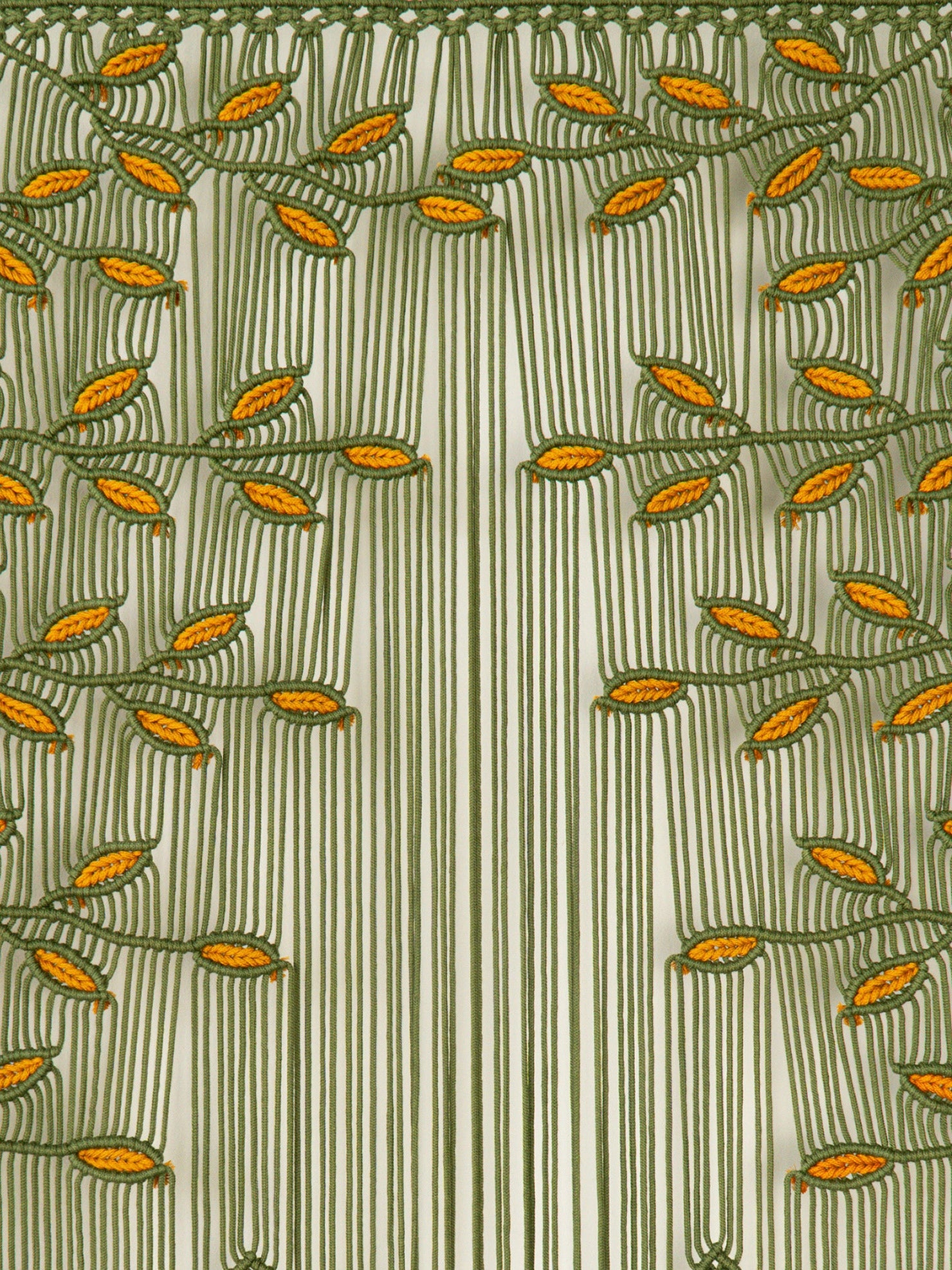 A close-up of a patterned curtain or fabric panel featuring vertical olive green stripes on a warm cream background, decorated with embroidered leafy vines in olive green and mustard yellow.