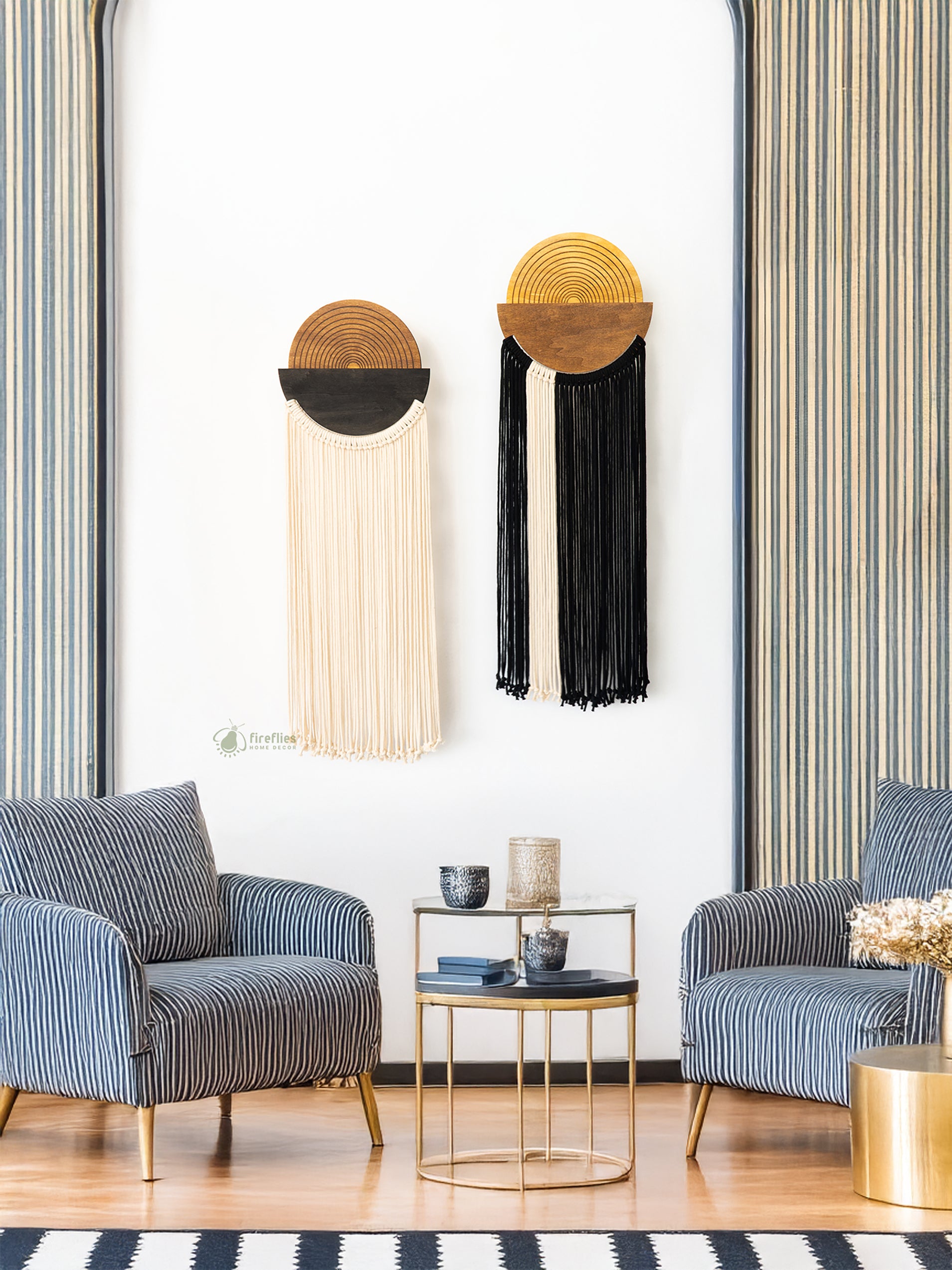Modern living room with striped armchairs, a gold side table, and decorative wall art.