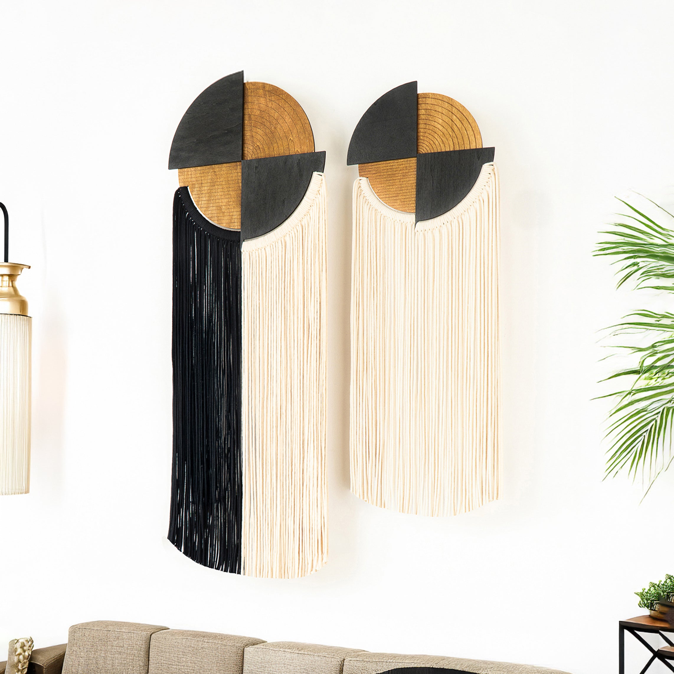 Decorative wall lights with geometric design on a white wall.