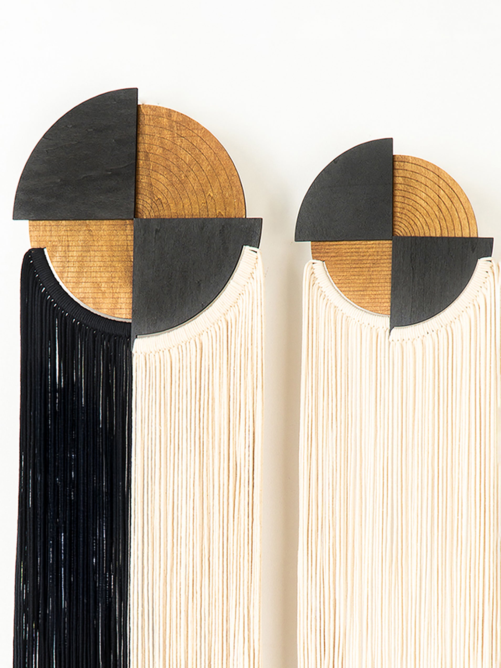 Two bookends with wooden tops and black triangular bases on a white background