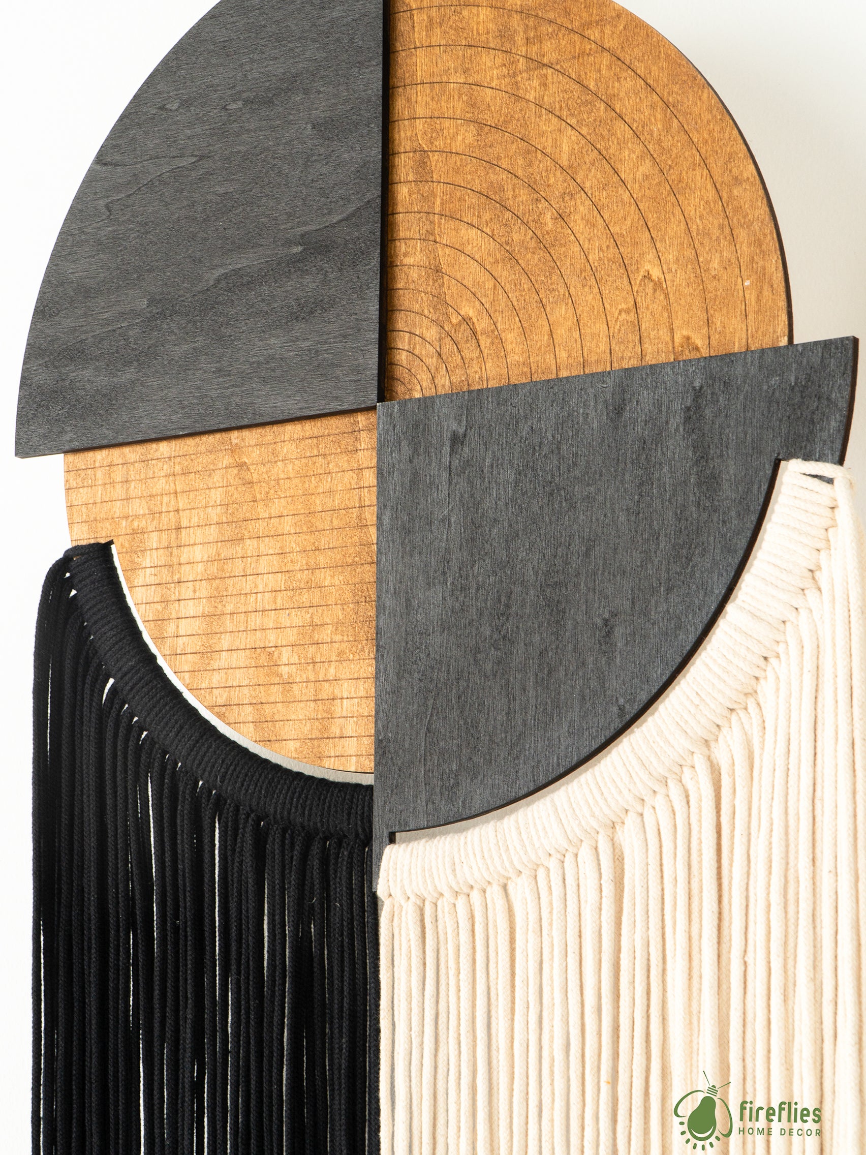 Decorative wall piece with wooden and fabric elements, featuring the brand 'Fireflies'.