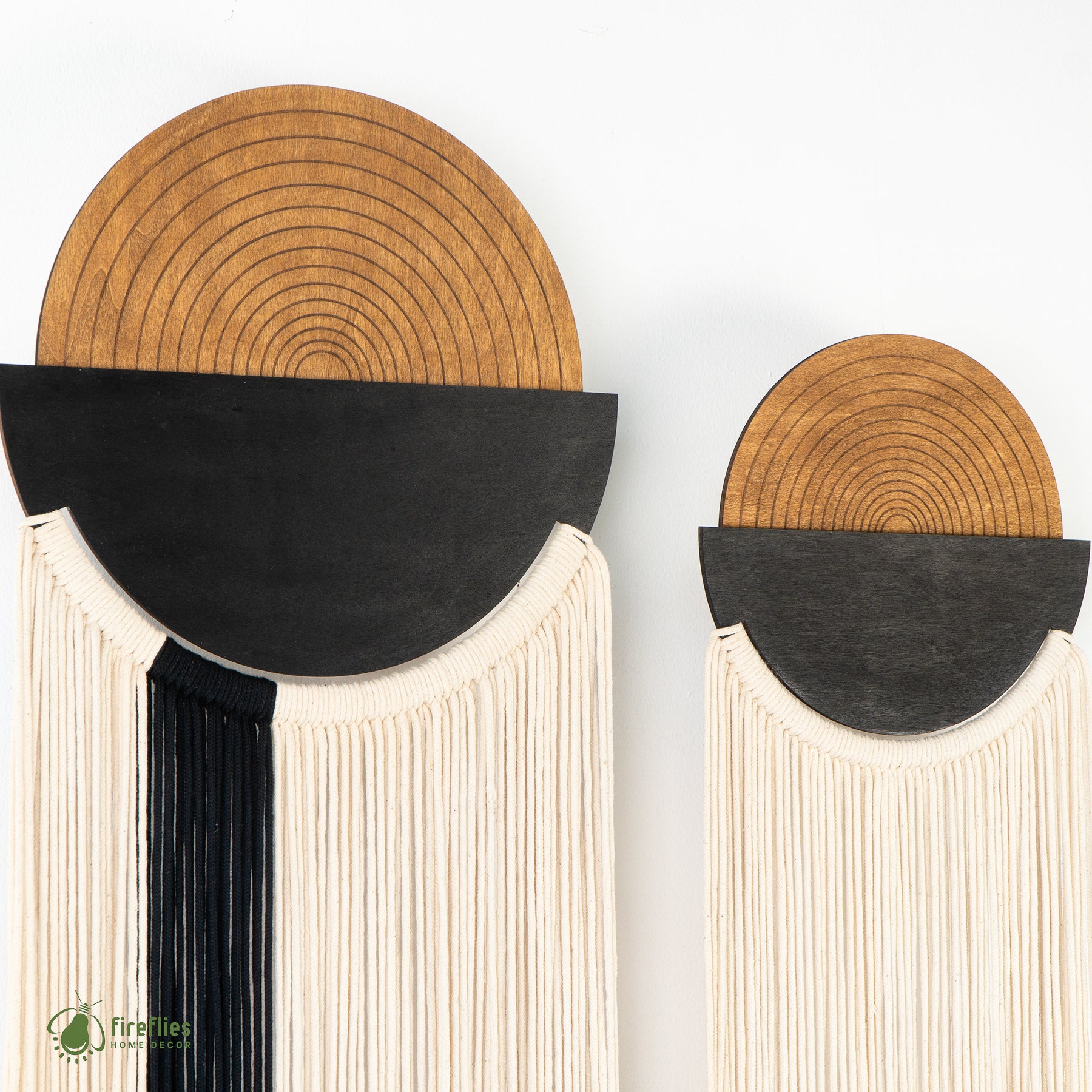 Decorative wall art pieces with wooden and black design on a white background