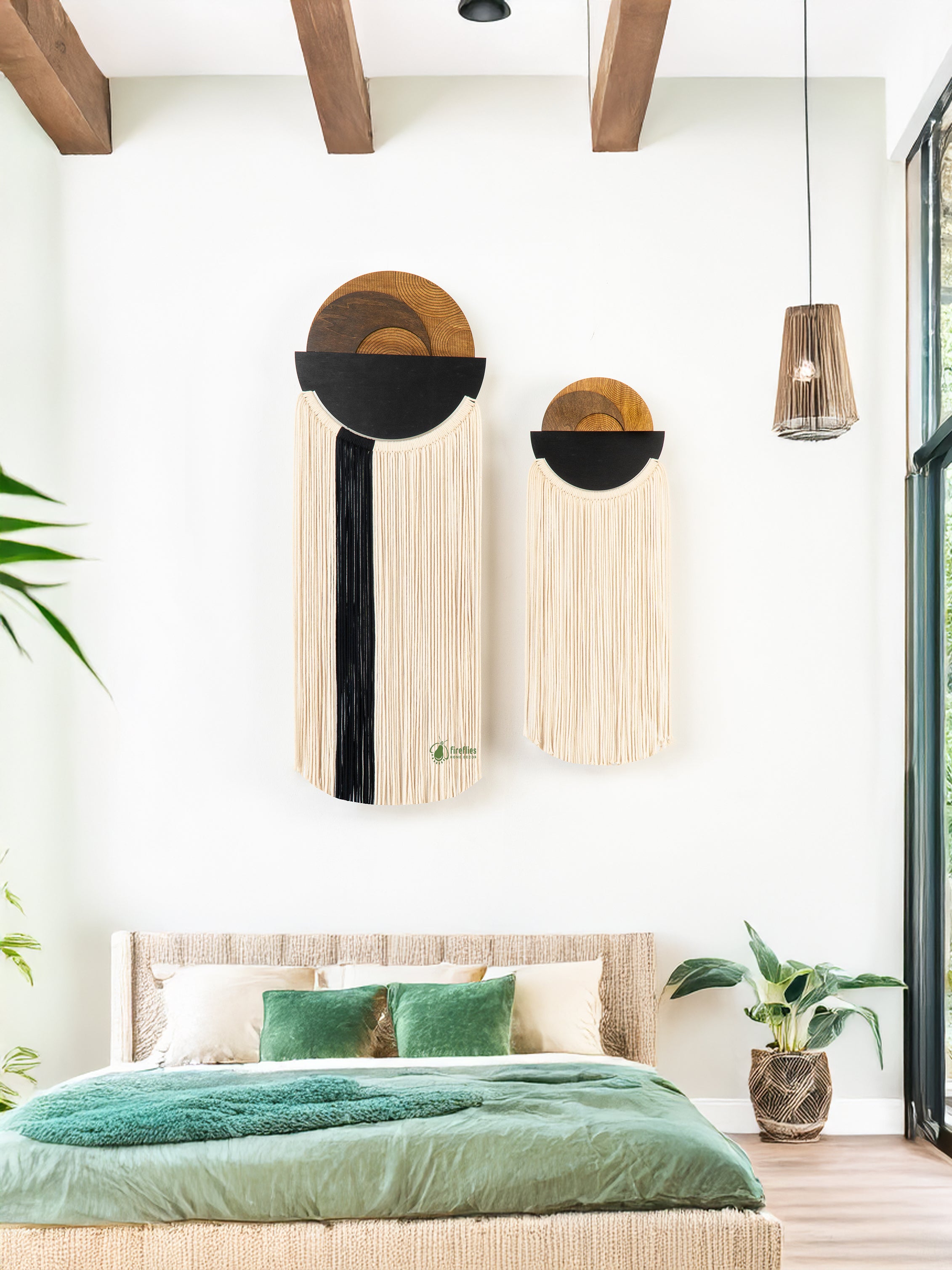 Decorative wall art above a bed in a bedroom with green bedding.