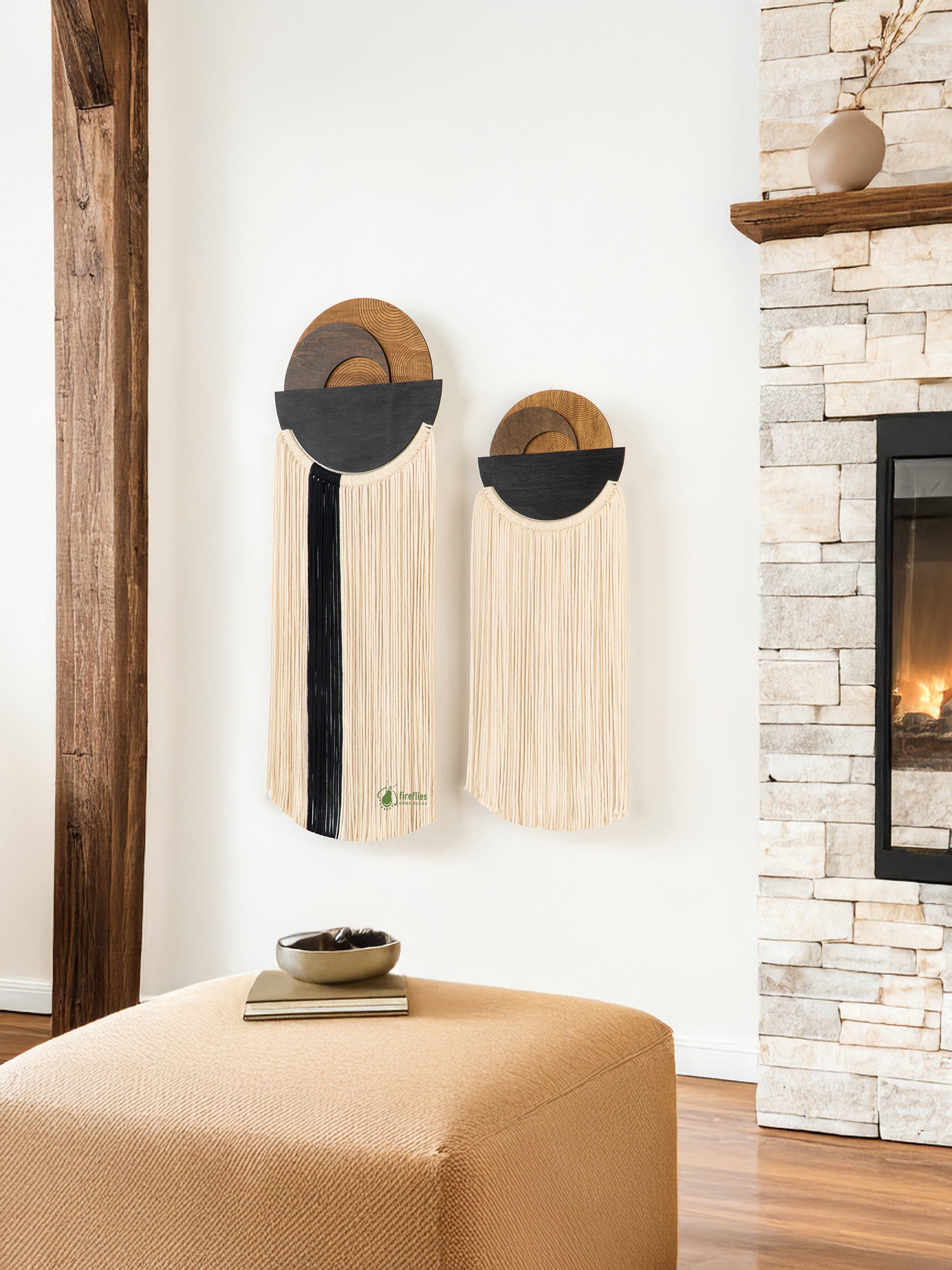 Decorative wall art with circular designs in a room with a fireplace.