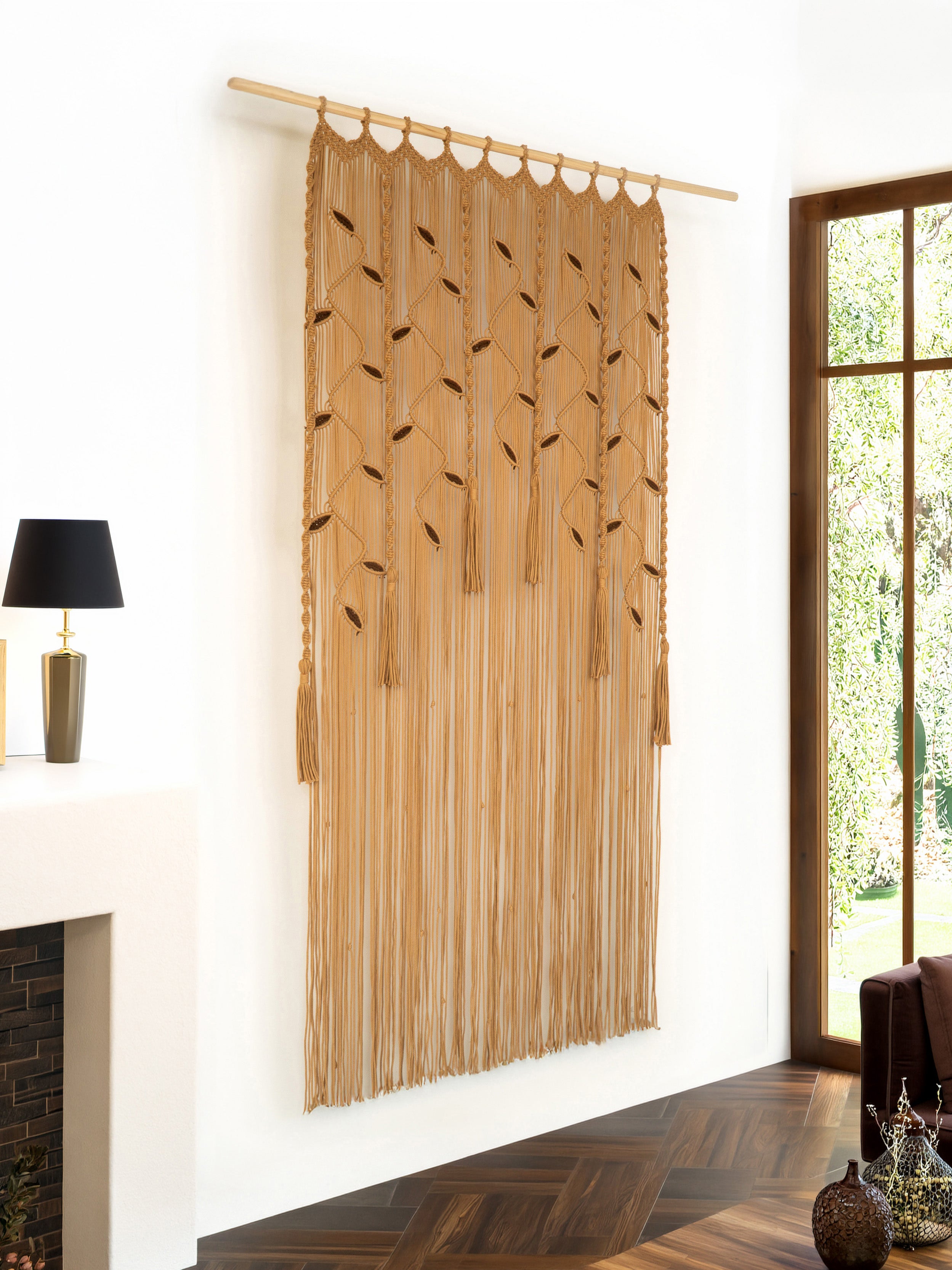 Large botanical macrame wall hanging with intricate leaf and vine patterns in latte beige.