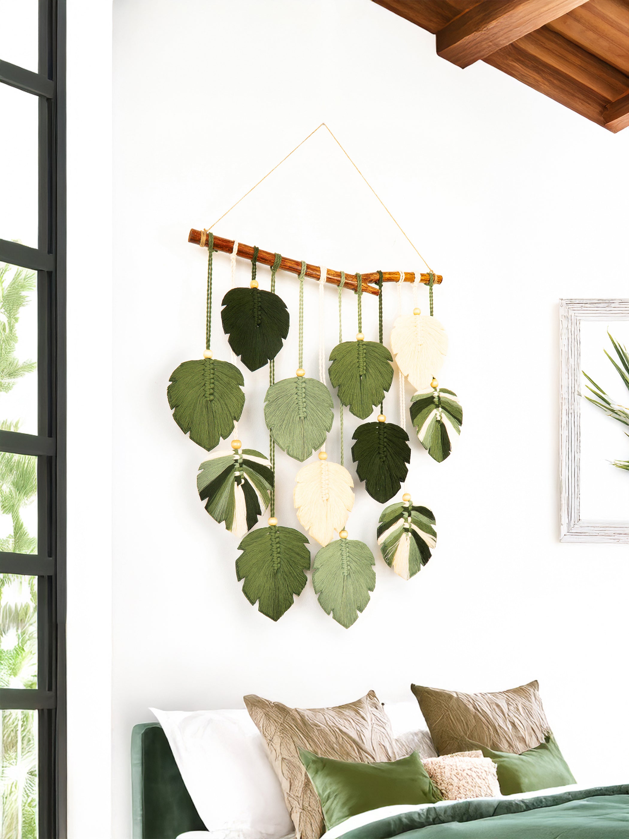 Decorative wall hanging with leaf patterns in a bedroom setting
