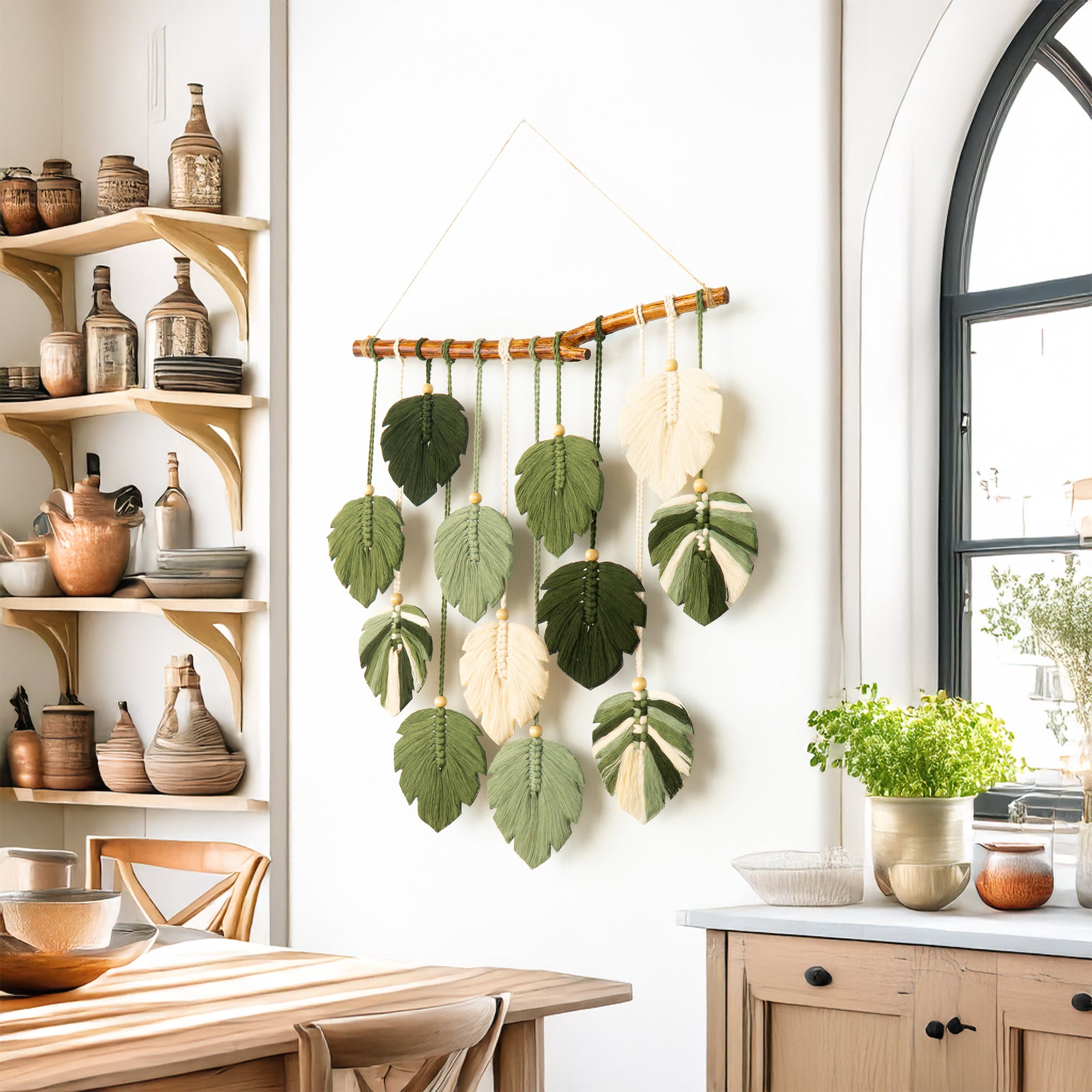 Decorative wall hanging with leaf patterns in a kitchen setting