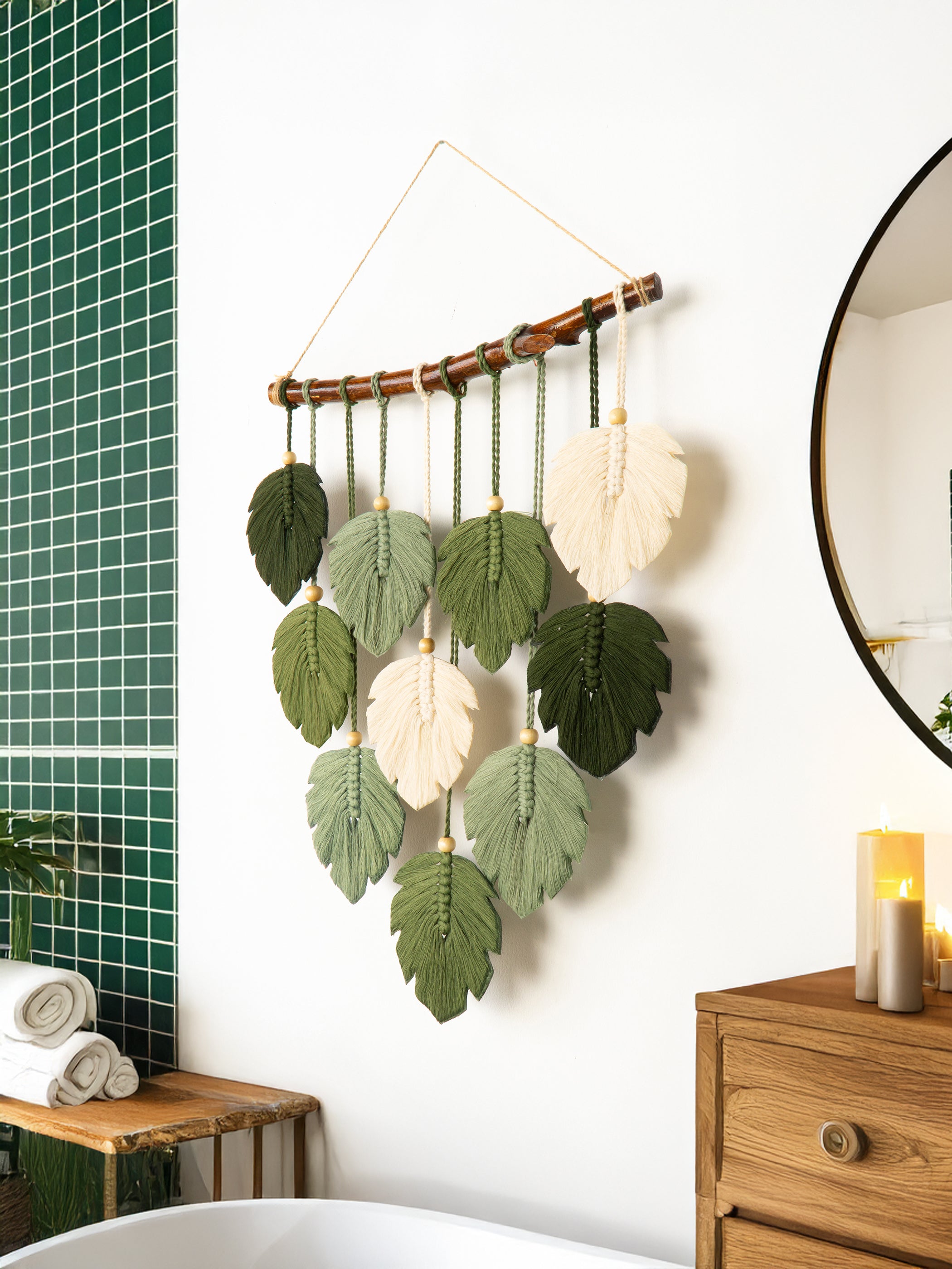 Decorative wall hanging with leaf patterns in a bathroom setting.