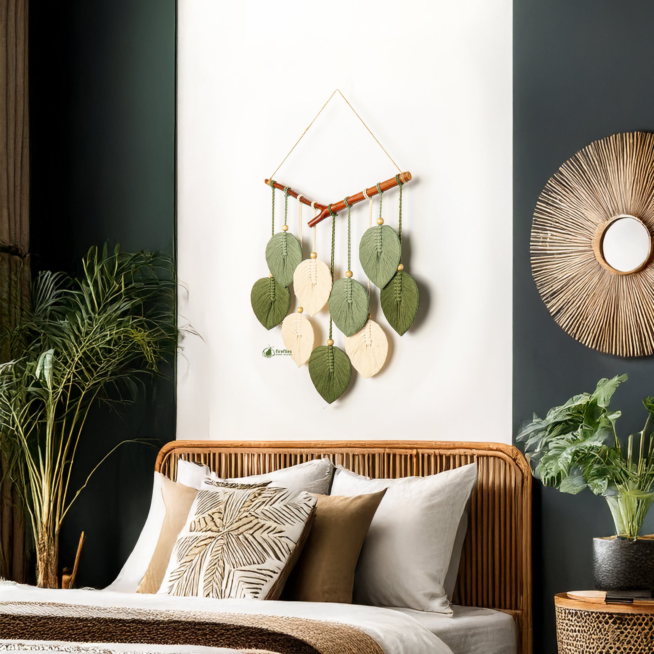 Decorative wall hanging with leaves above a bed in a bedroom setting.
