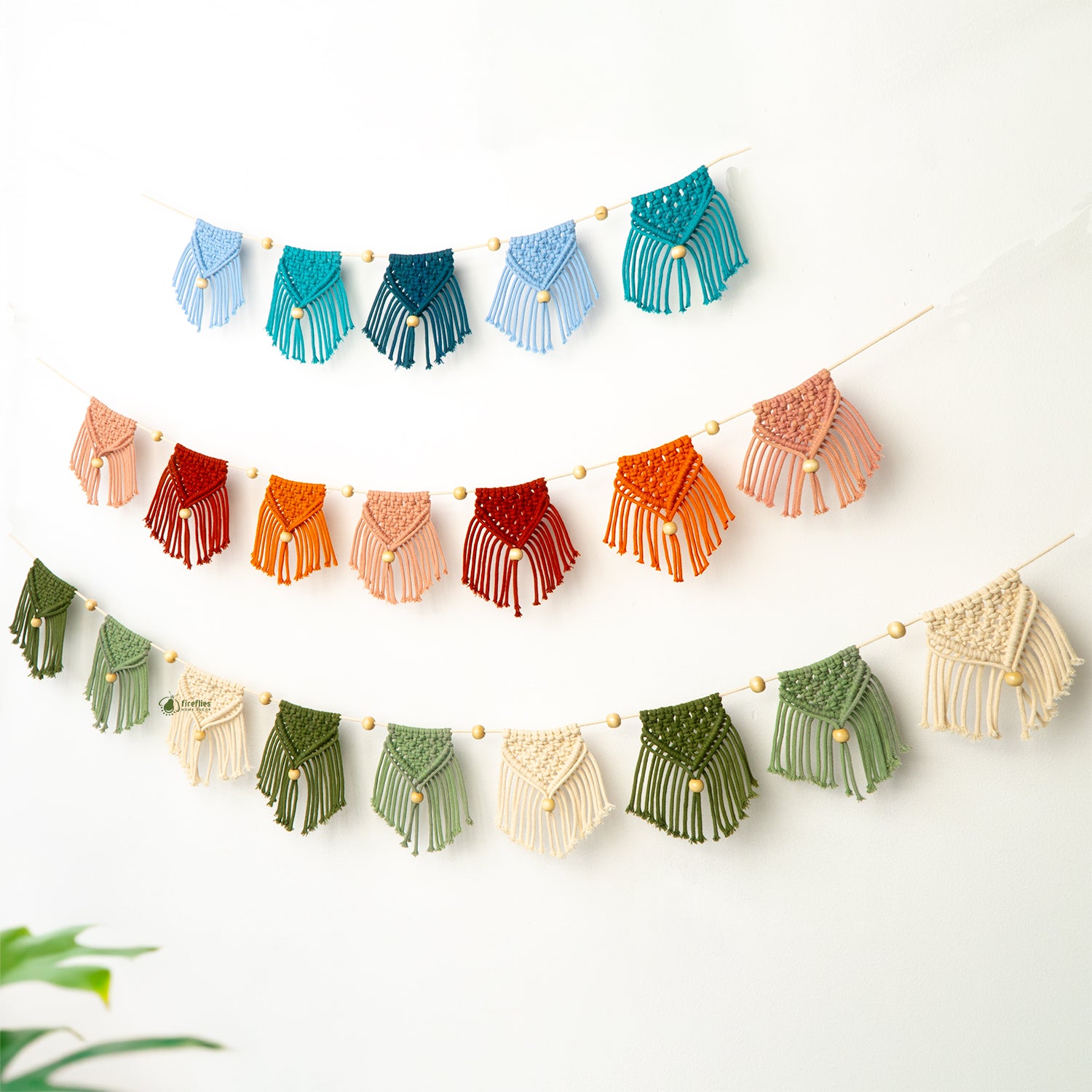 Colorful macrame wall hanging on a white background