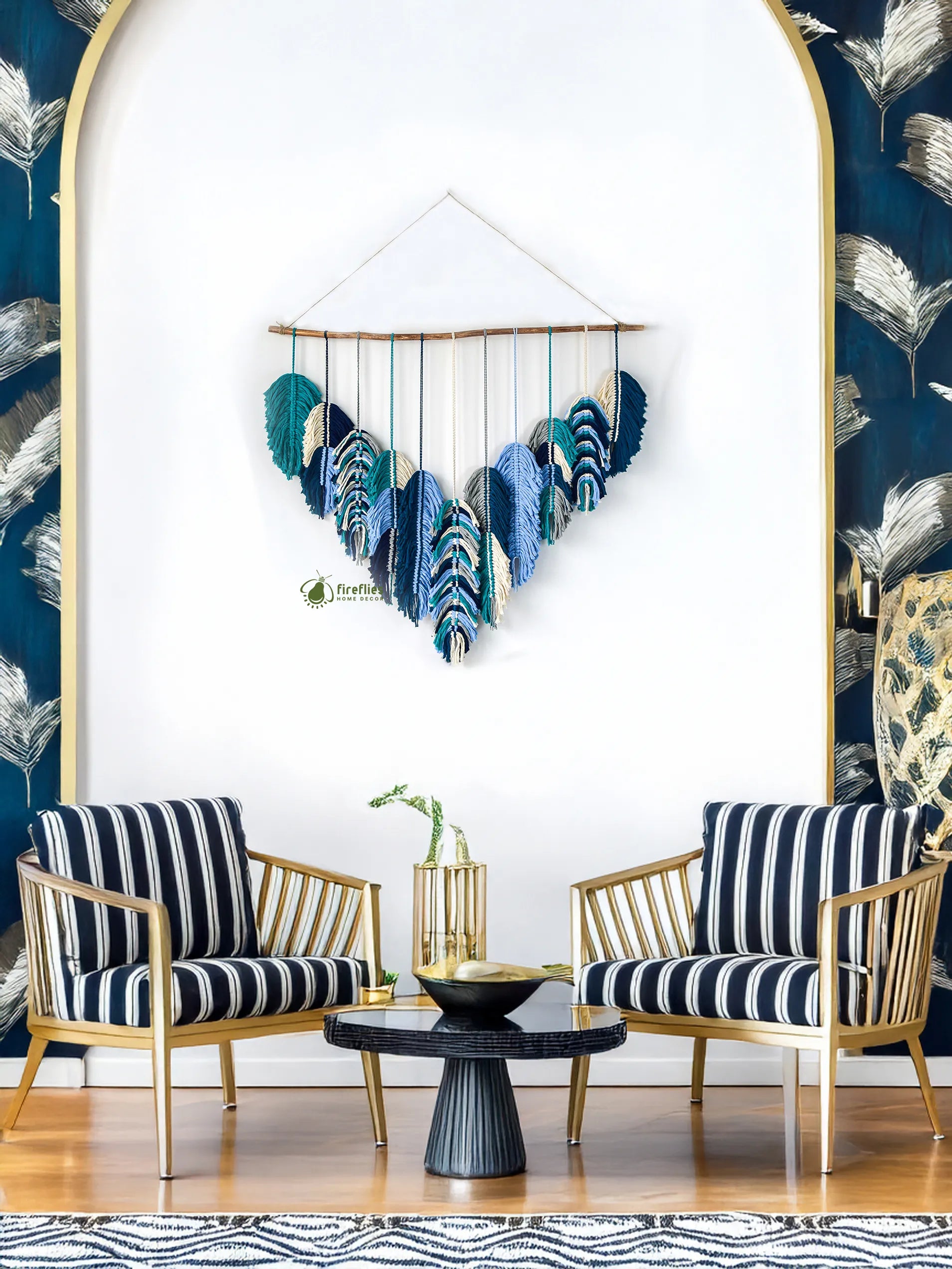 Decorative wall hanging with feathers in a stylish room with chairs and a coffee table.