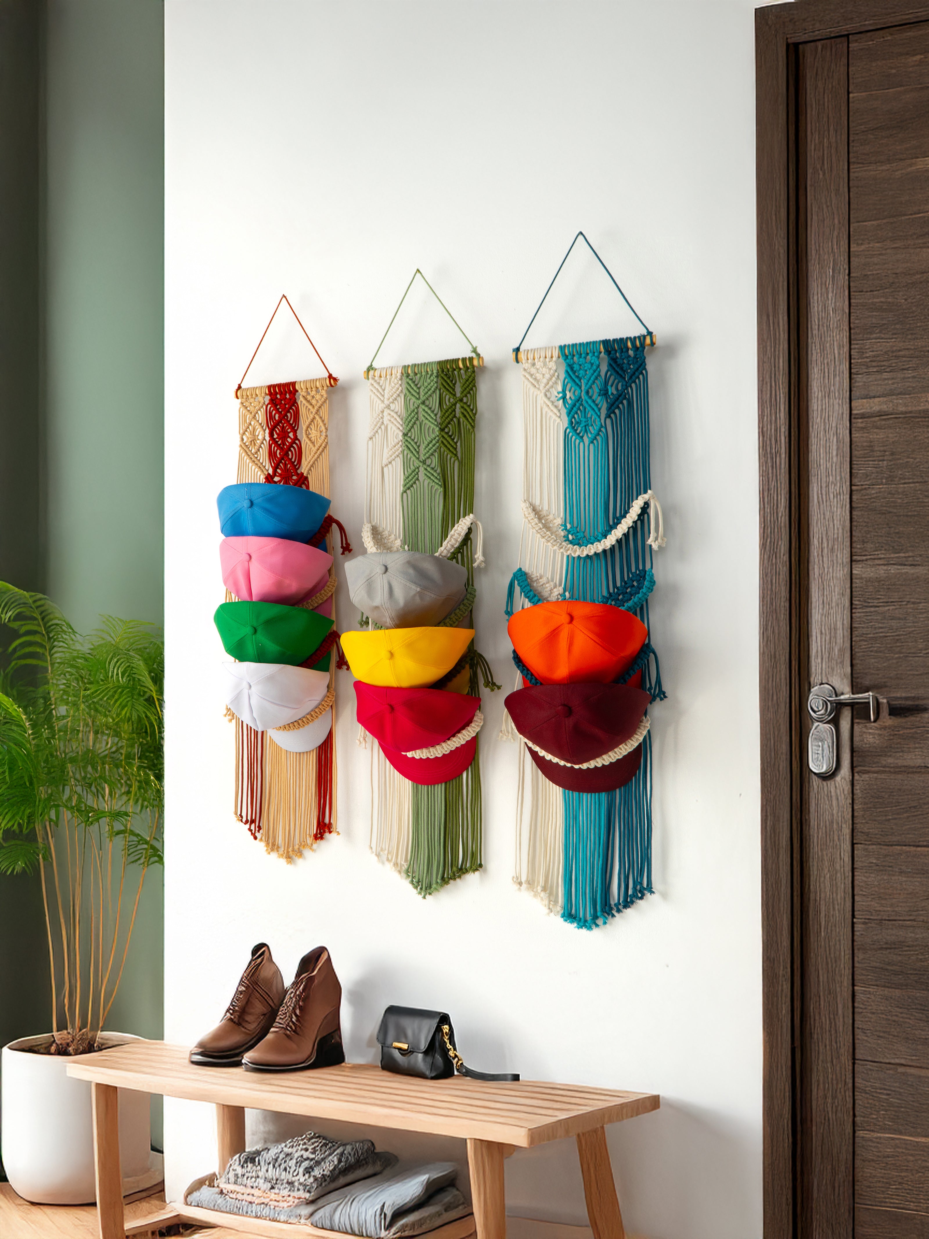 Colorful knitted scarves hanging on a wall organizer with a wooden bench below.