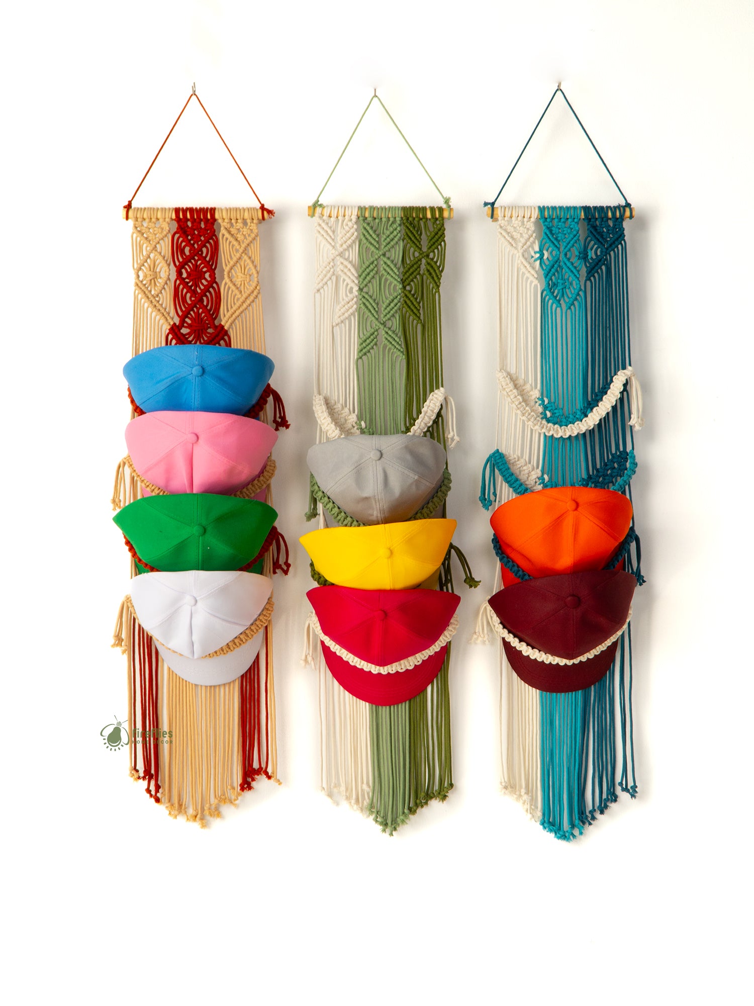 Colorful macrame wall hanging with variously shaped containers on a white background