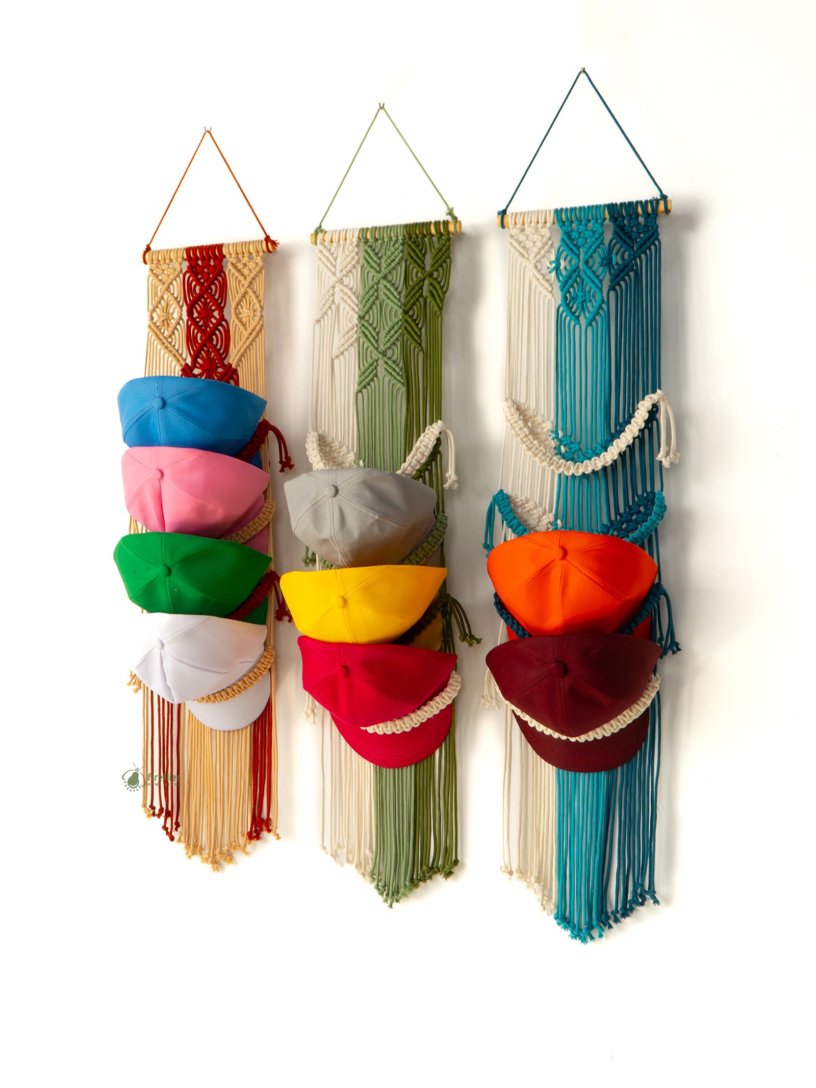 Colorful hat organizer with various colored hats hanging on a white background