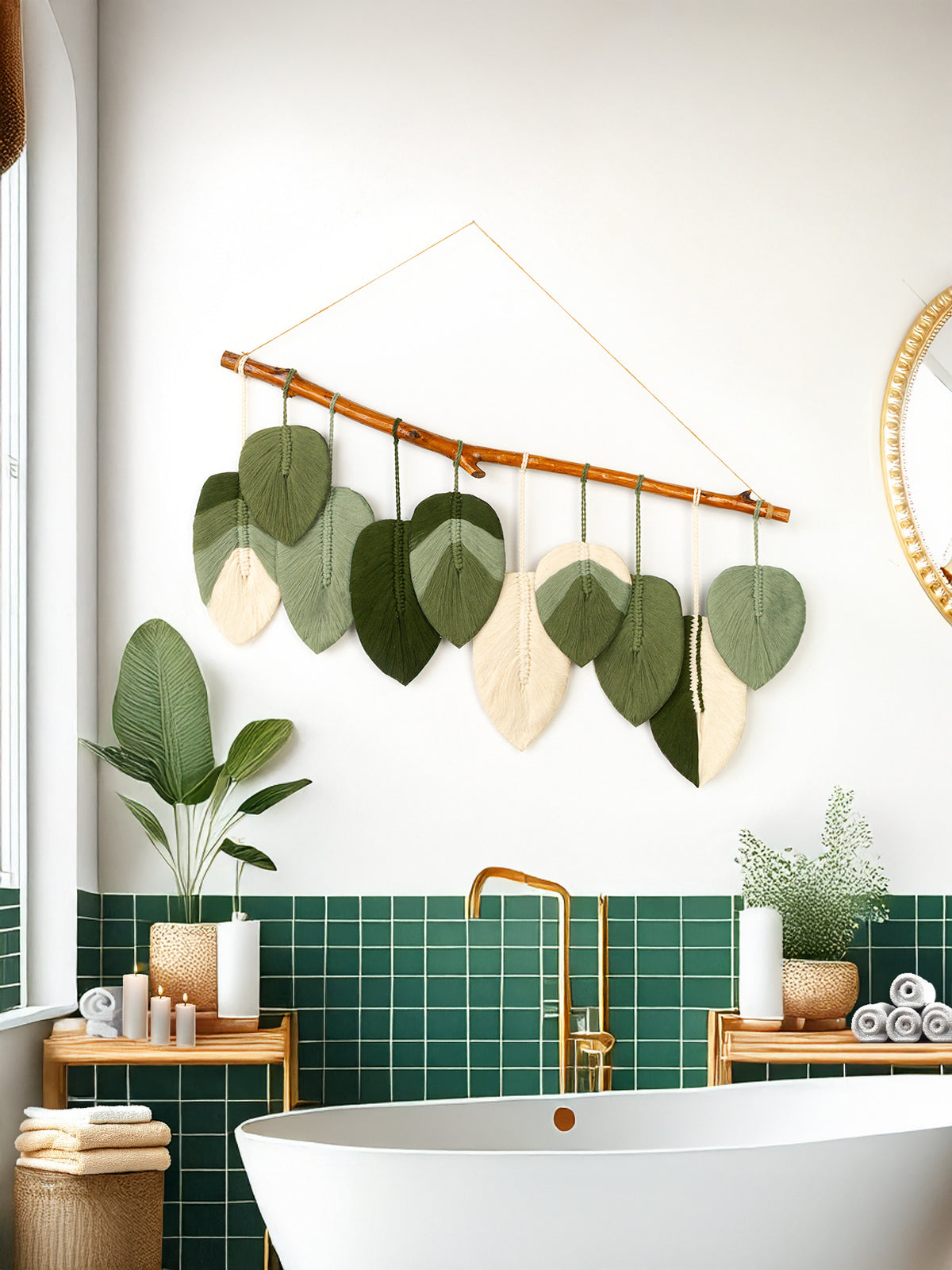 Bathroom interior with green tiles, a white bathtub, and decorative leaf wall art.