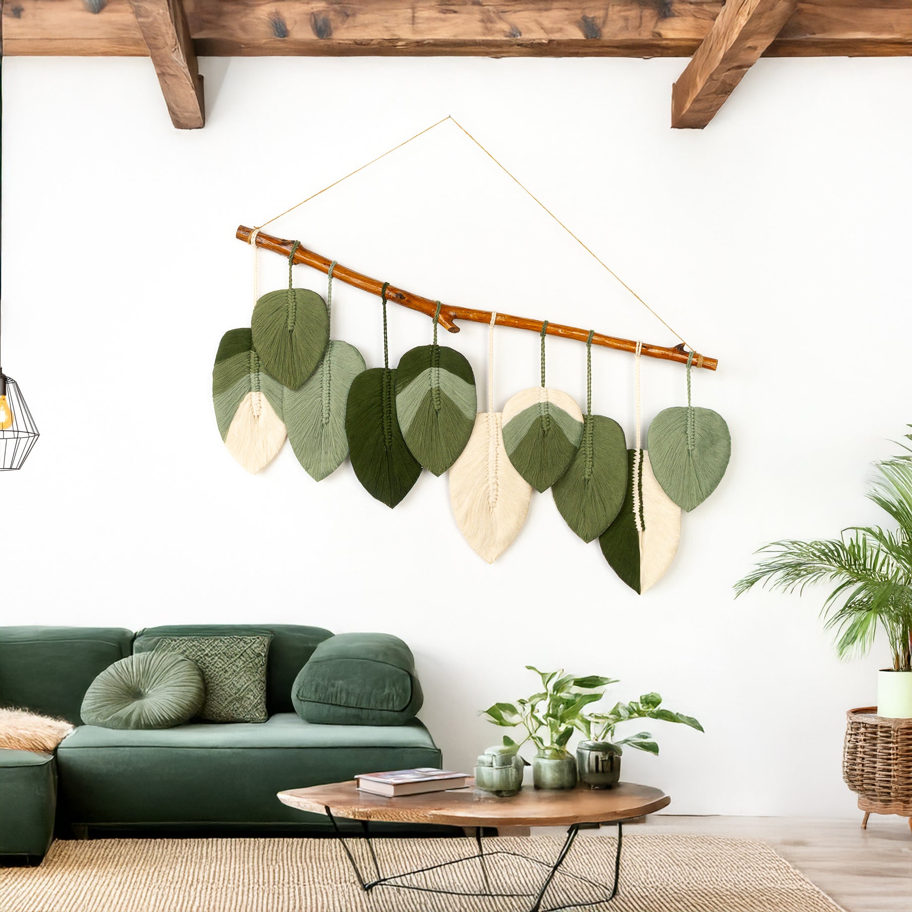 Decorative wall hanging with leaf-shaped elements in a living room setting.