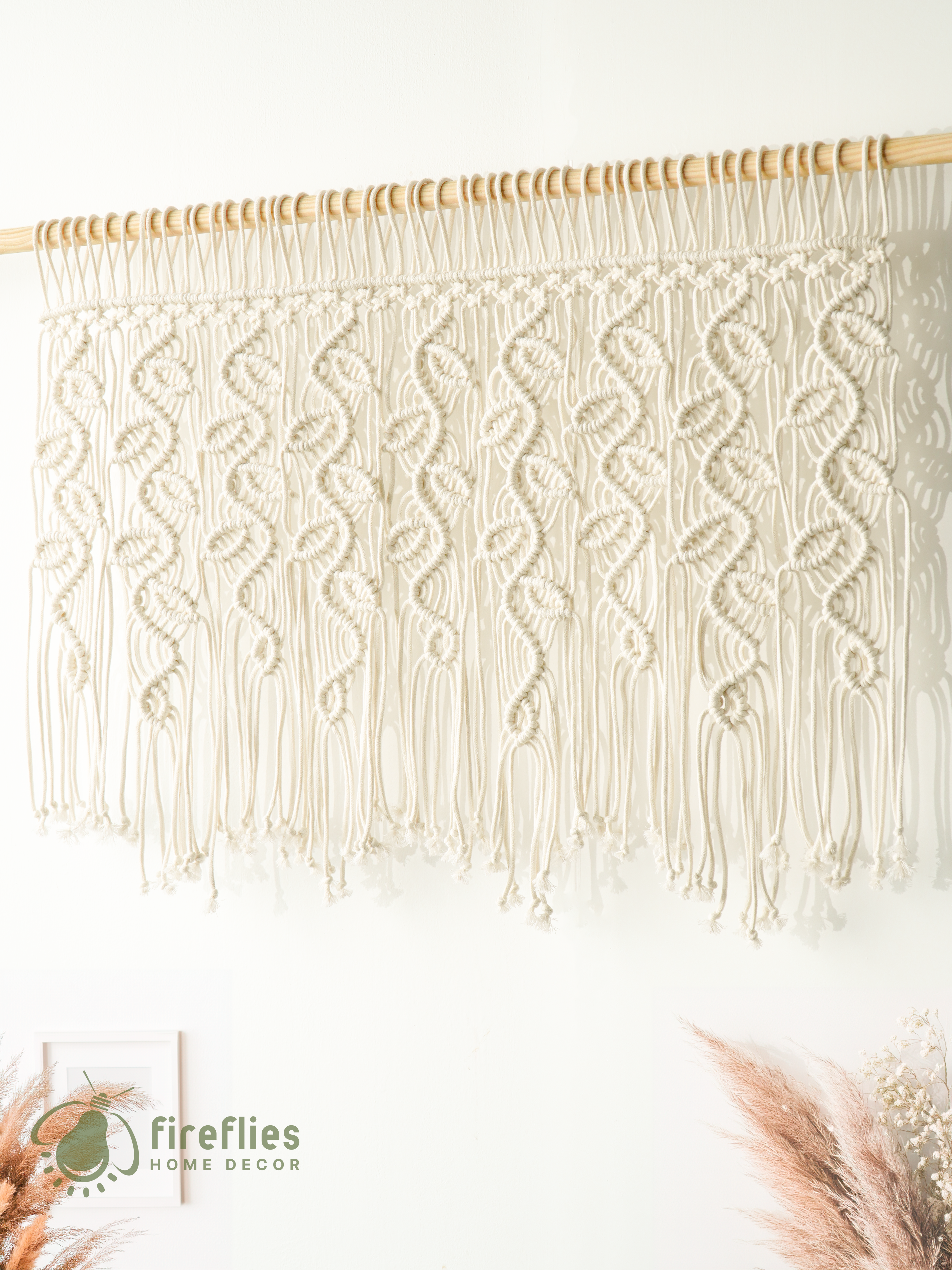 Handcrafted macrame curtain, ideal for modern or rustic spaces 
