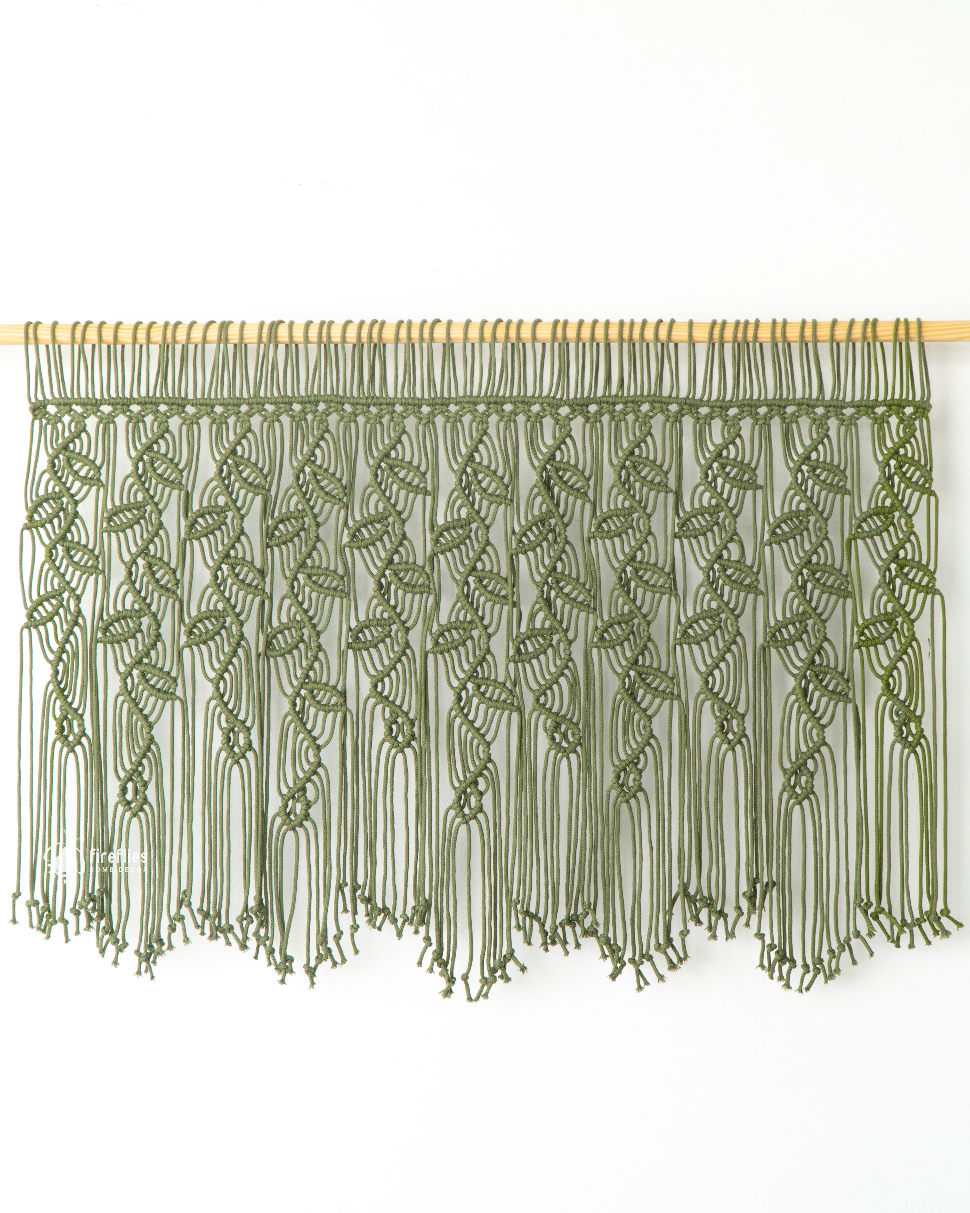 Handwoven macrame curtain, perfect for adding natural charm 
