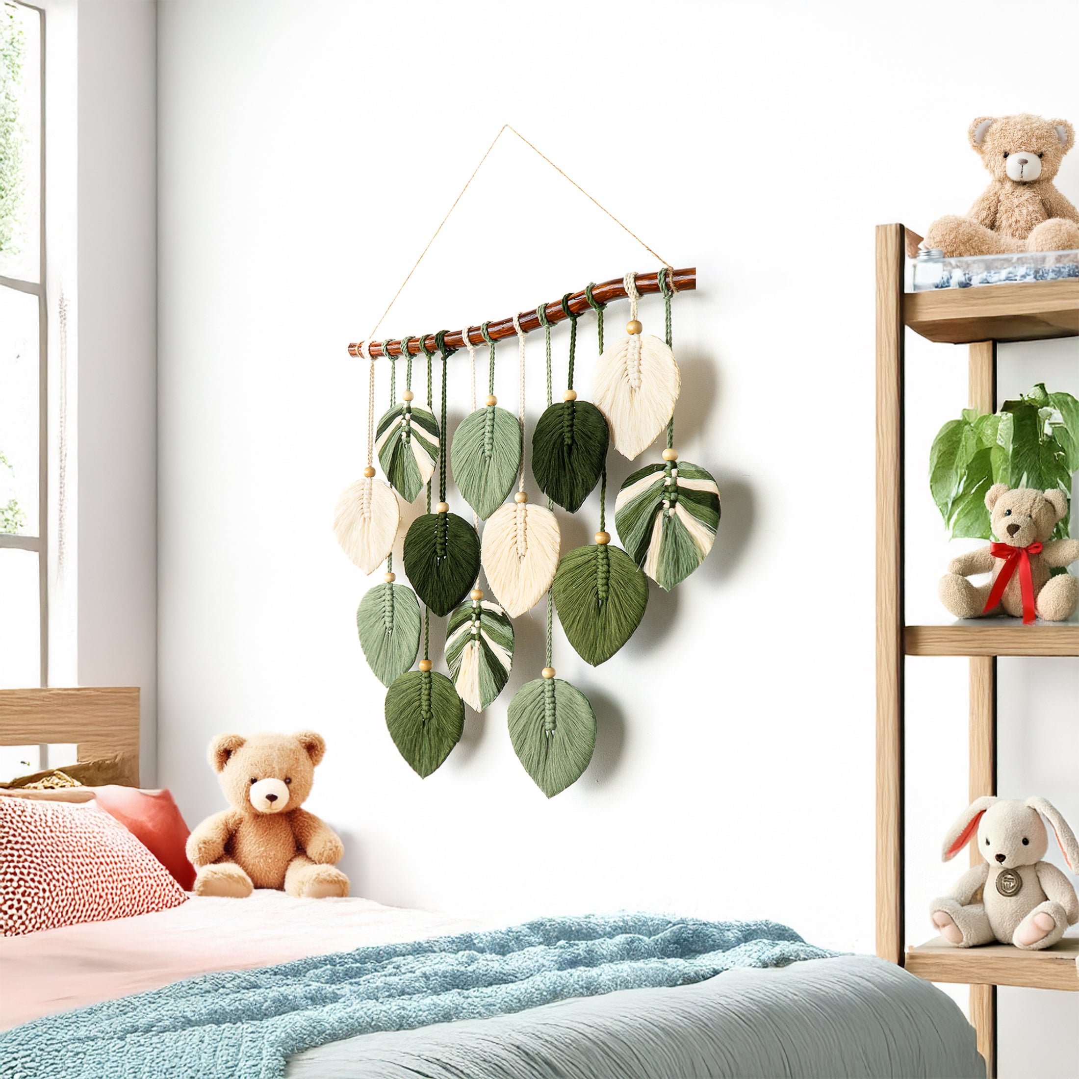 Decorative wall hanging with leaf patterns in a child's room with teddy bears and a shelf.