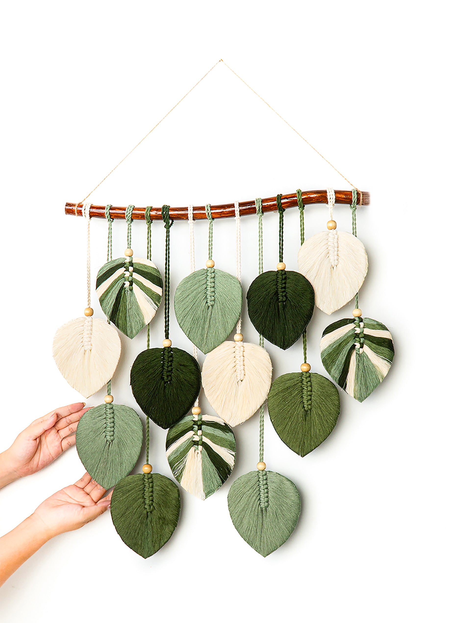 Decorative wall hanging with colorful leaf-shaped beads on a white background