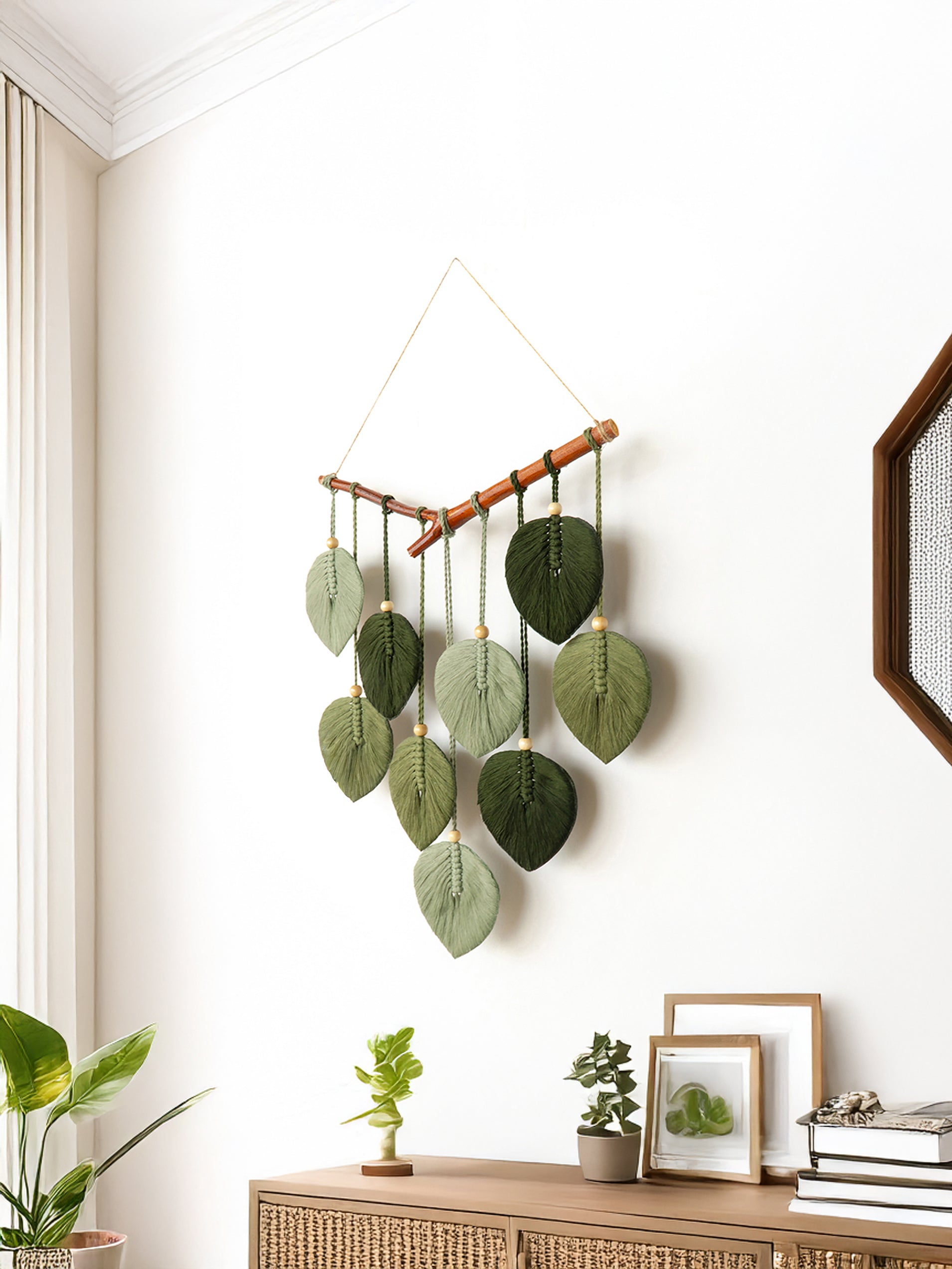 Decorative wall hanging with leaf-shaped elements in a home setting