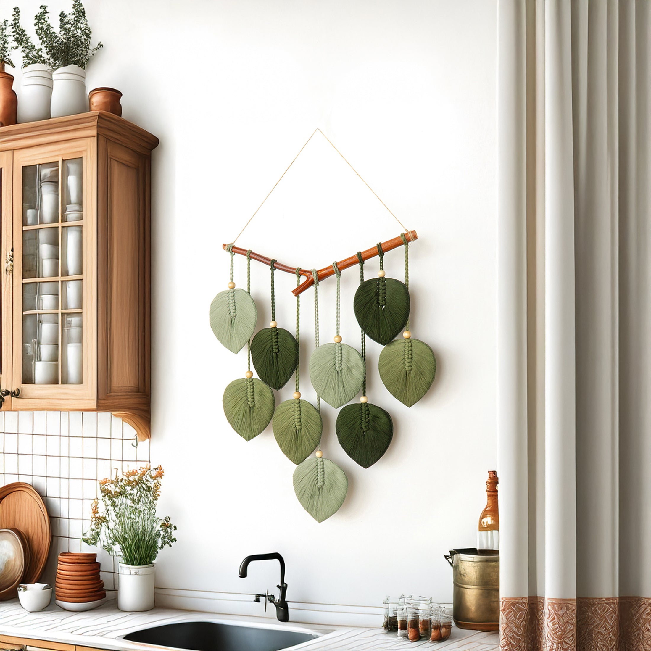 Decorative wall hanging with green leaves in a kitchen setting
