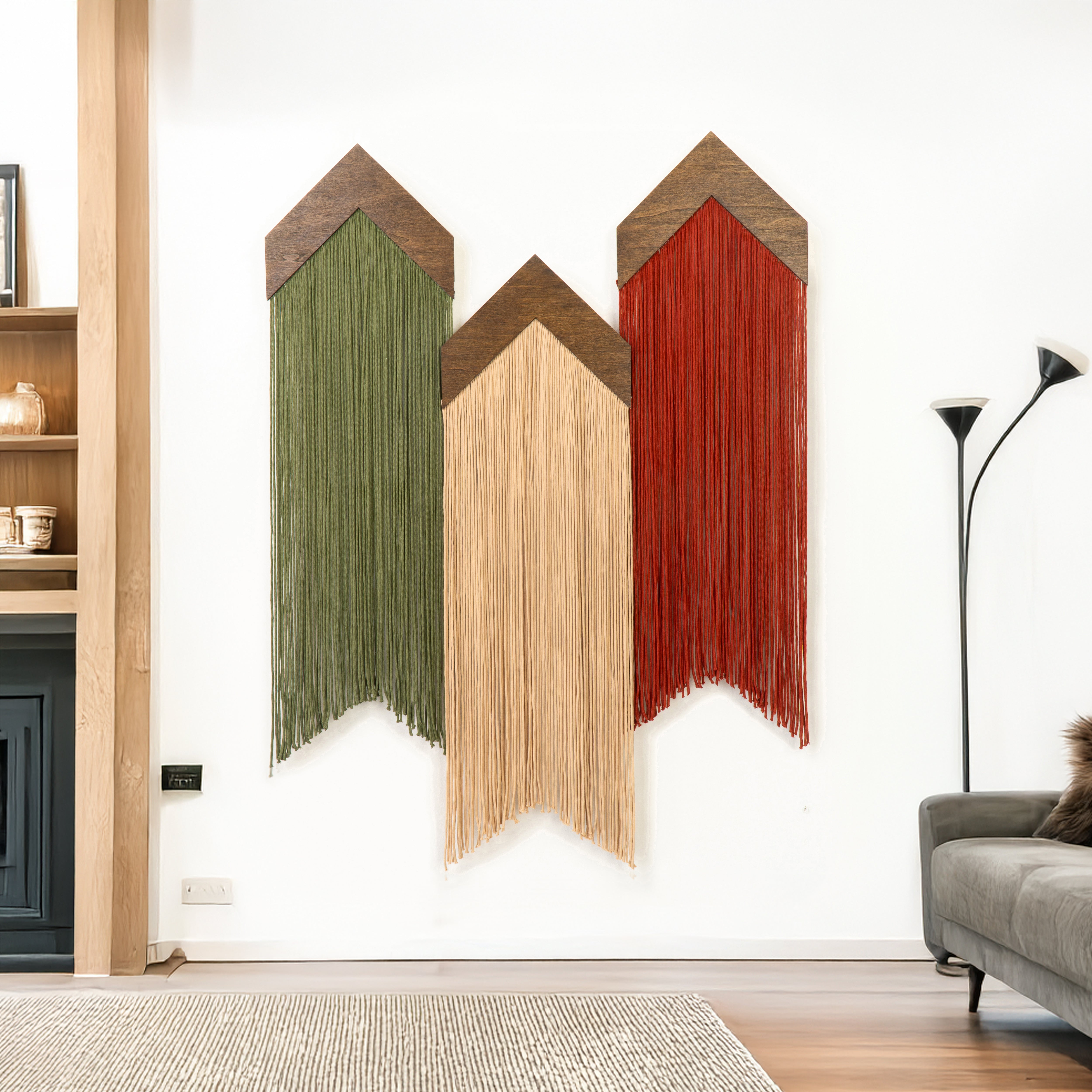 Color swatch wall art with green, beige, and red colors in a living room setting.