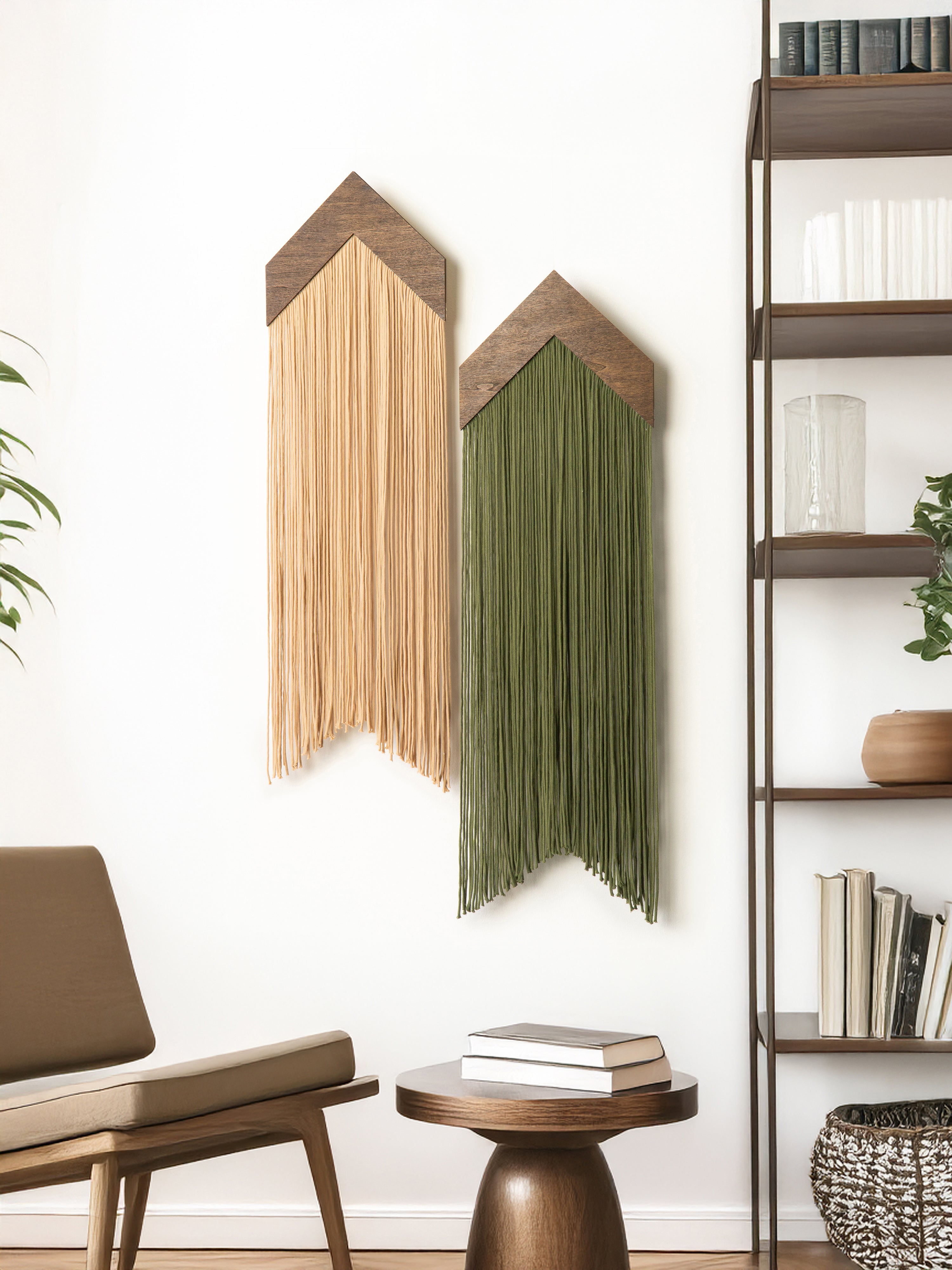 Wooden wall art pieces in a room with a bookshelf and furniture.