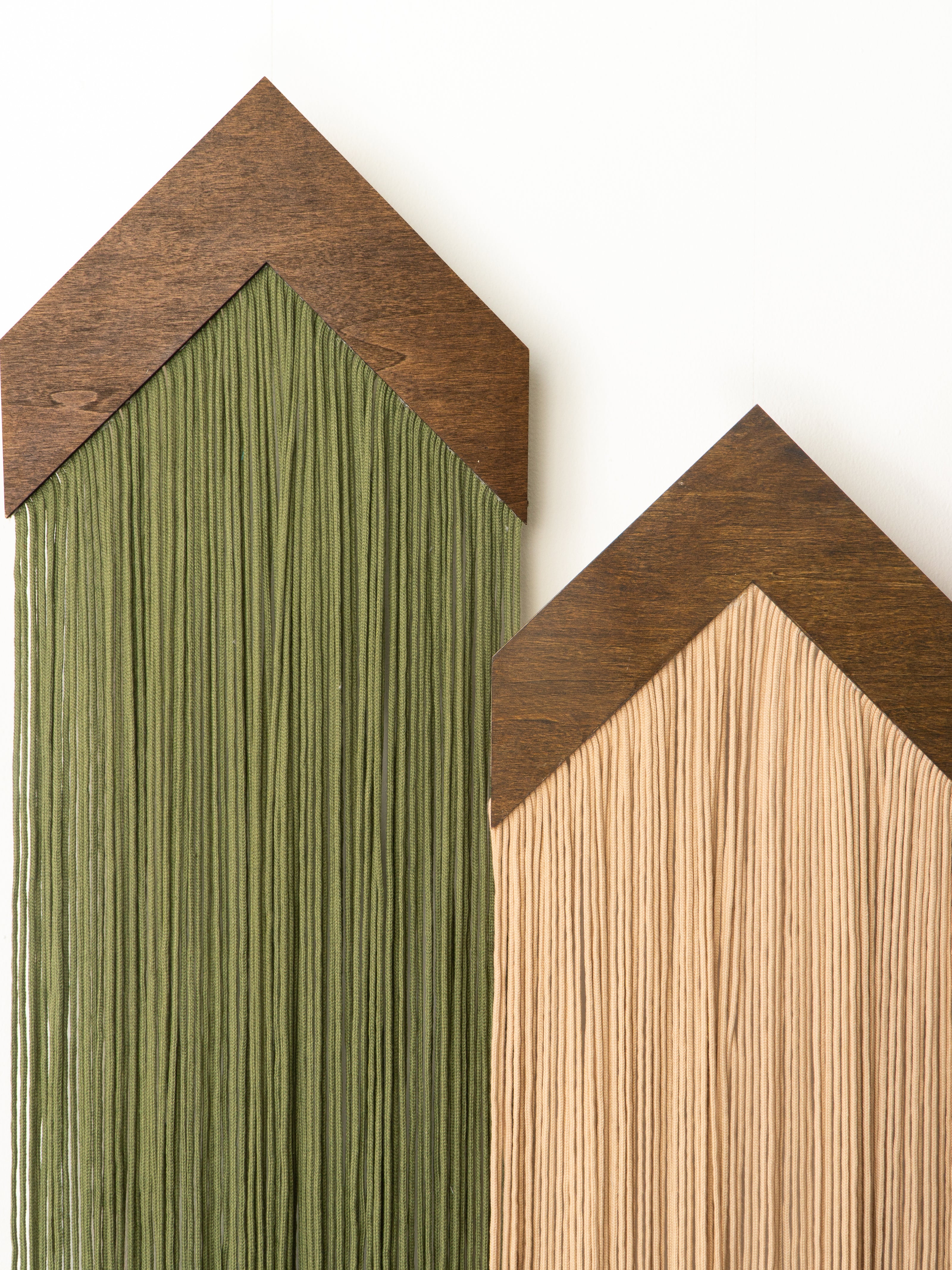 Two wooden panels with different finishes on a white background