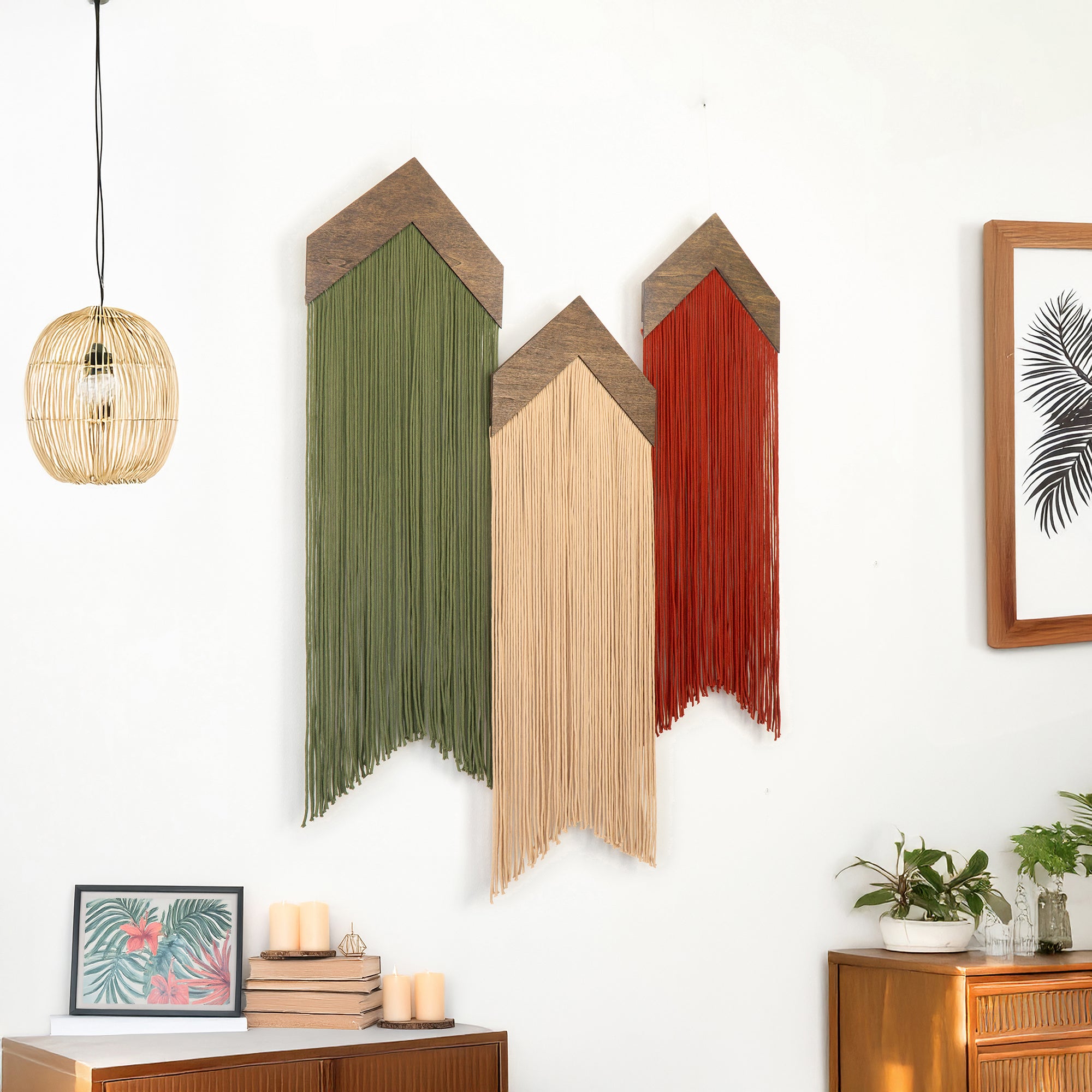 Decorative wall art with three colorful, geometric shapes on a white wall.