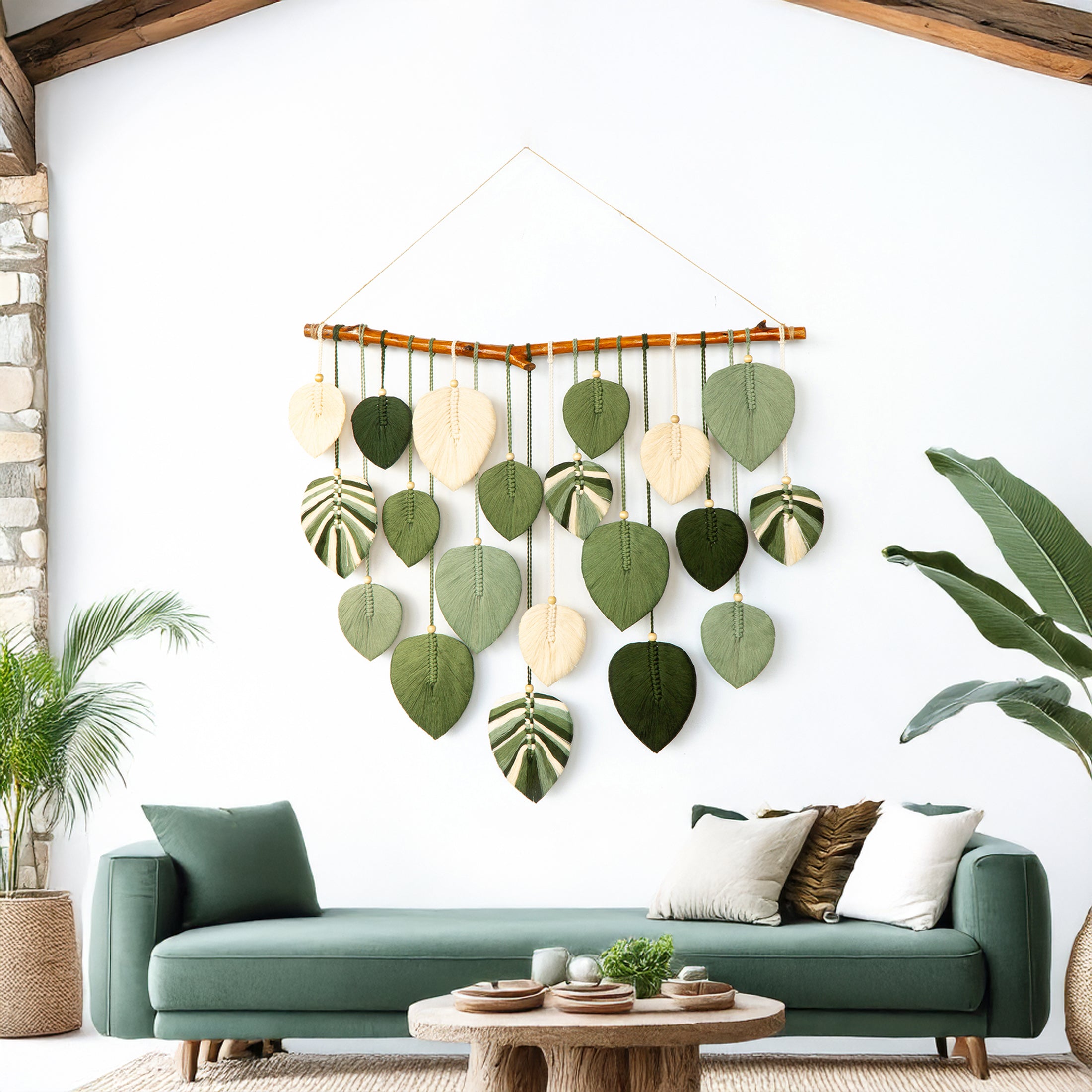 Decorative wall hanging with leaf shapes in a living room setting.