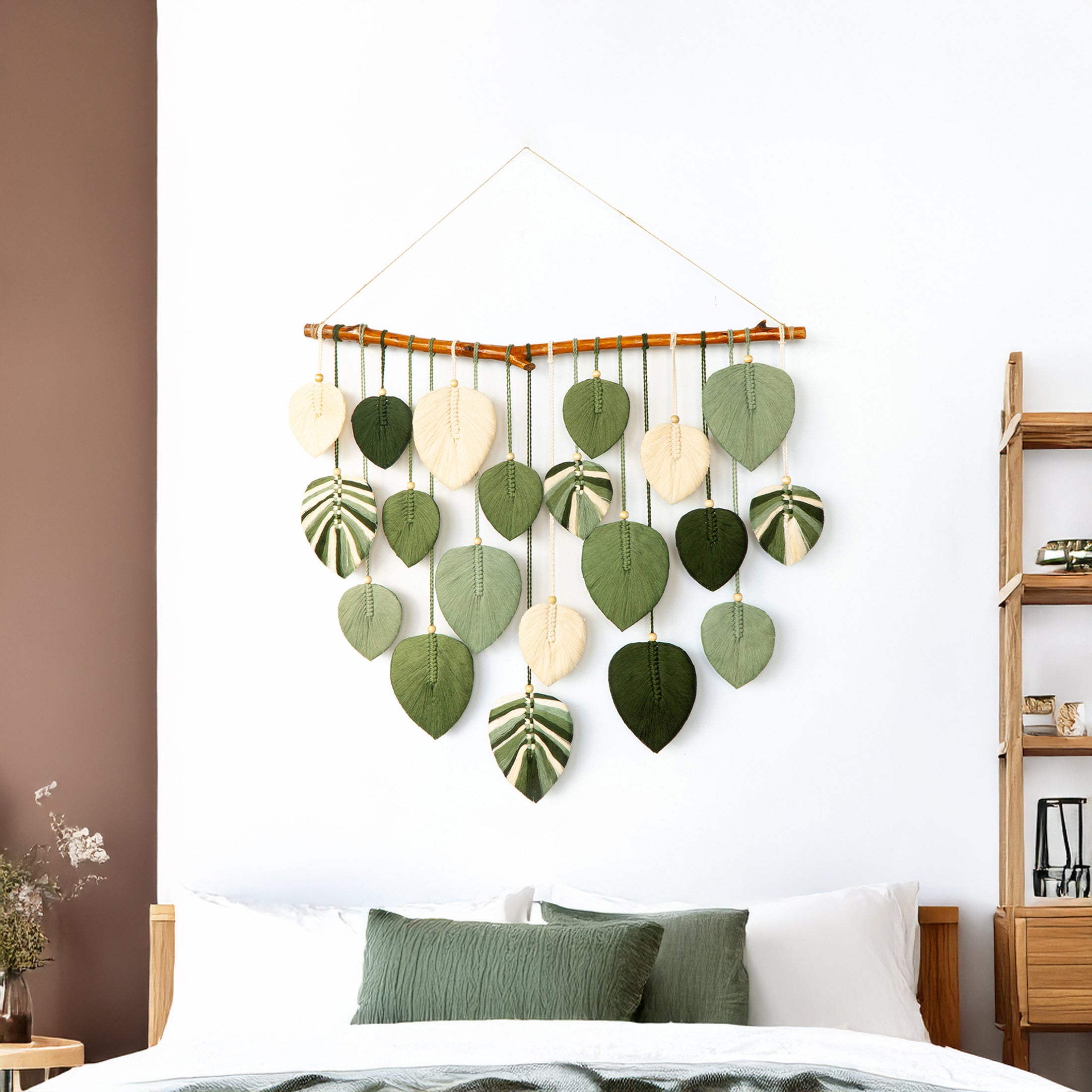 Decorative wall hanging with leaf patterns in a bedroom setting