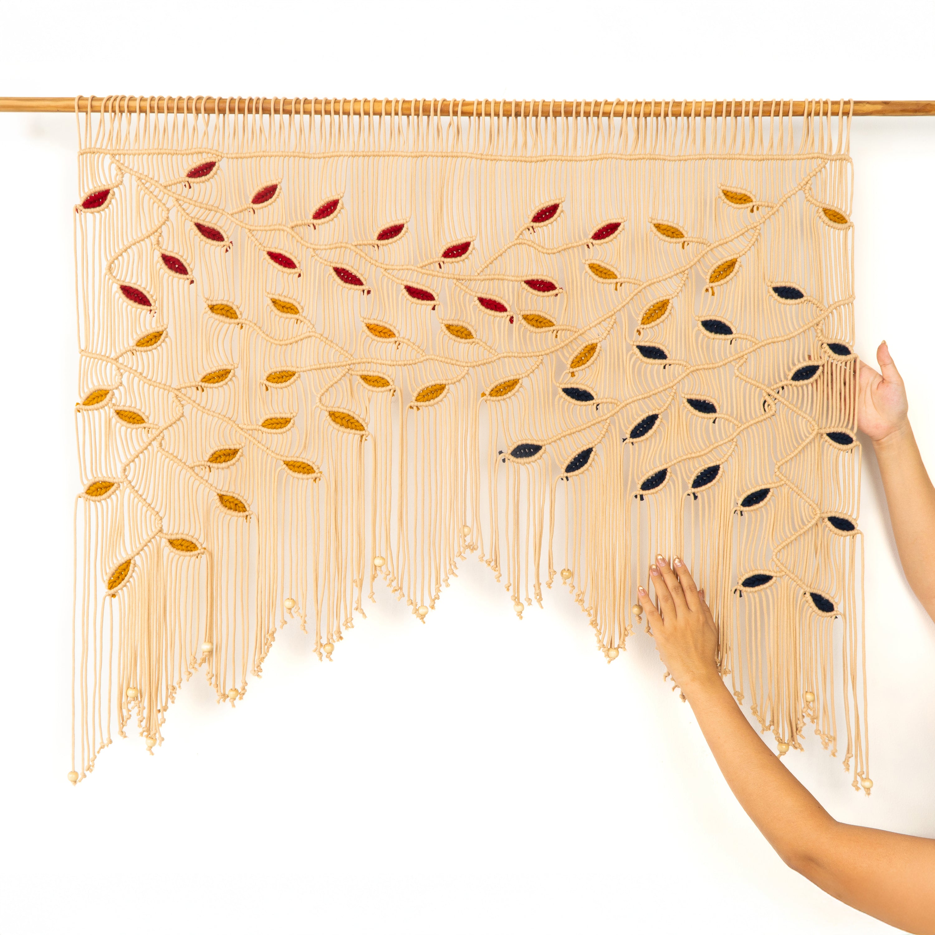 Decorative string art with colorful leaves on a white background