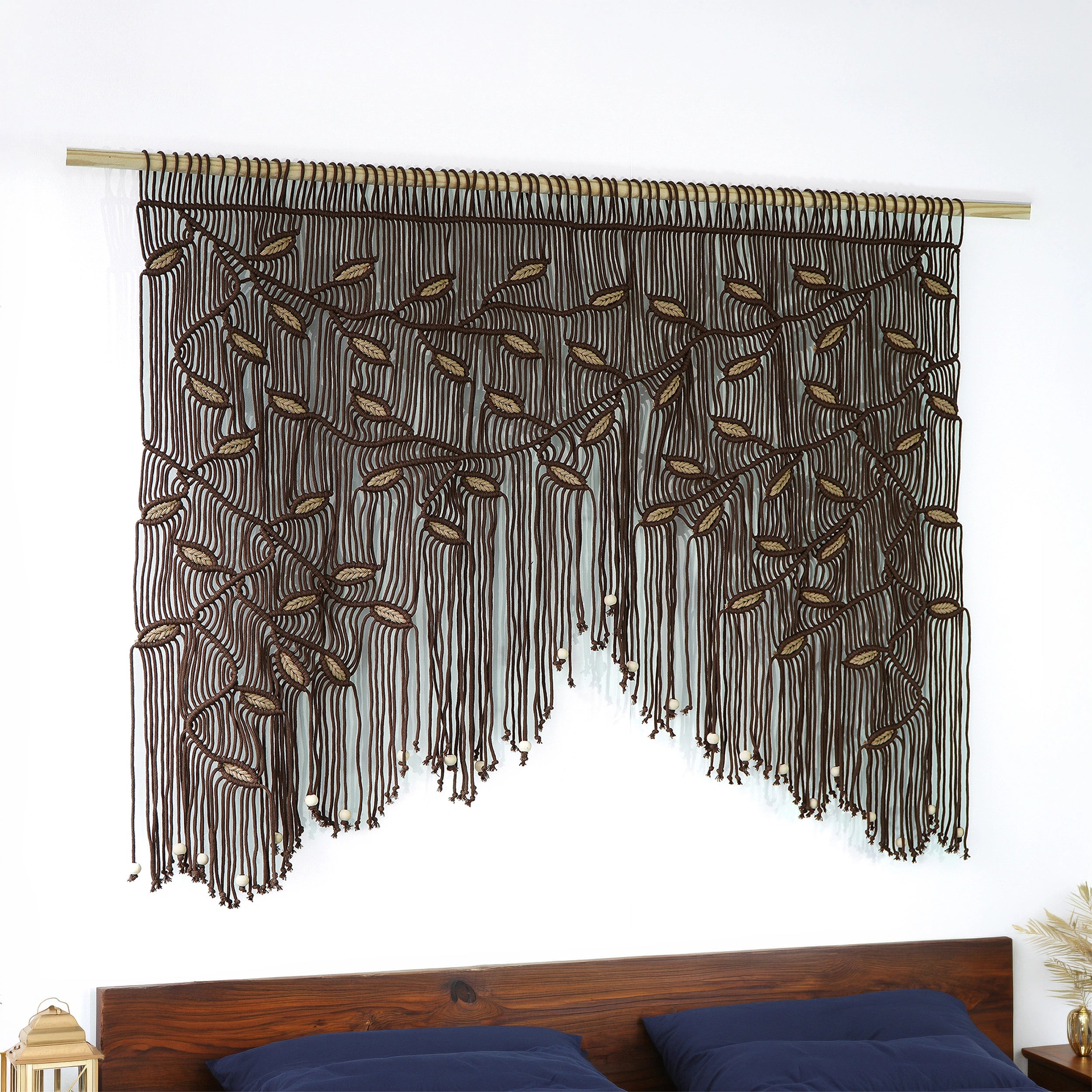 Chocolate brown macrame window valance or decorative horizontal tapestry with tan botanical details.
