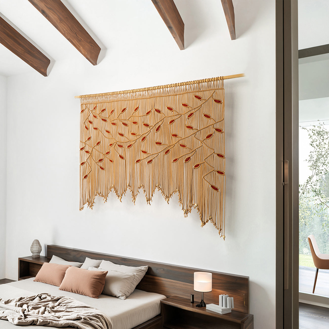 Large-scale artisan macrame featuring a horizontal botanical vine design in a warm latte palette.
