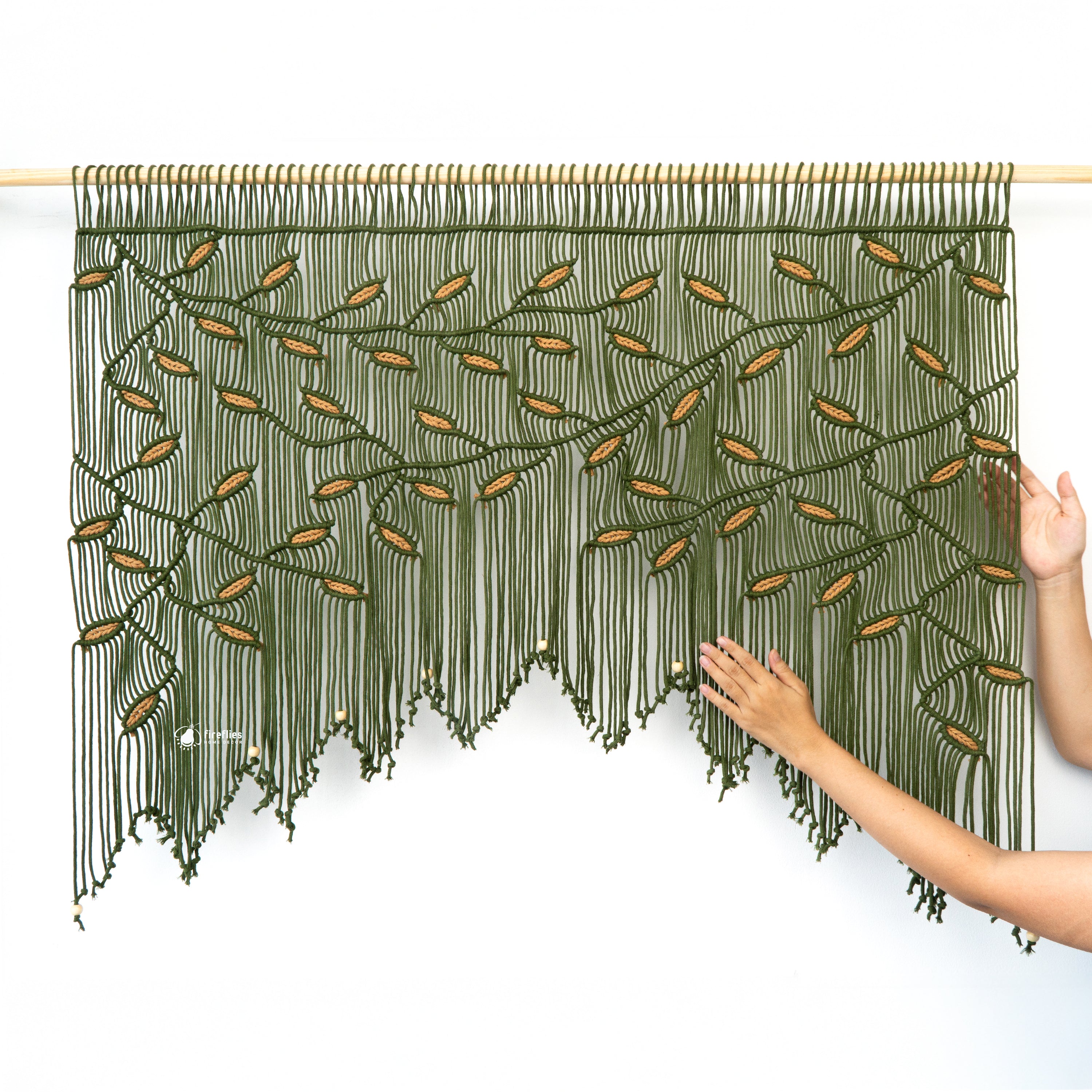 Close-up of textured white fabric with a subtle pattern, featuring 'fireflies Home Decor' logo.