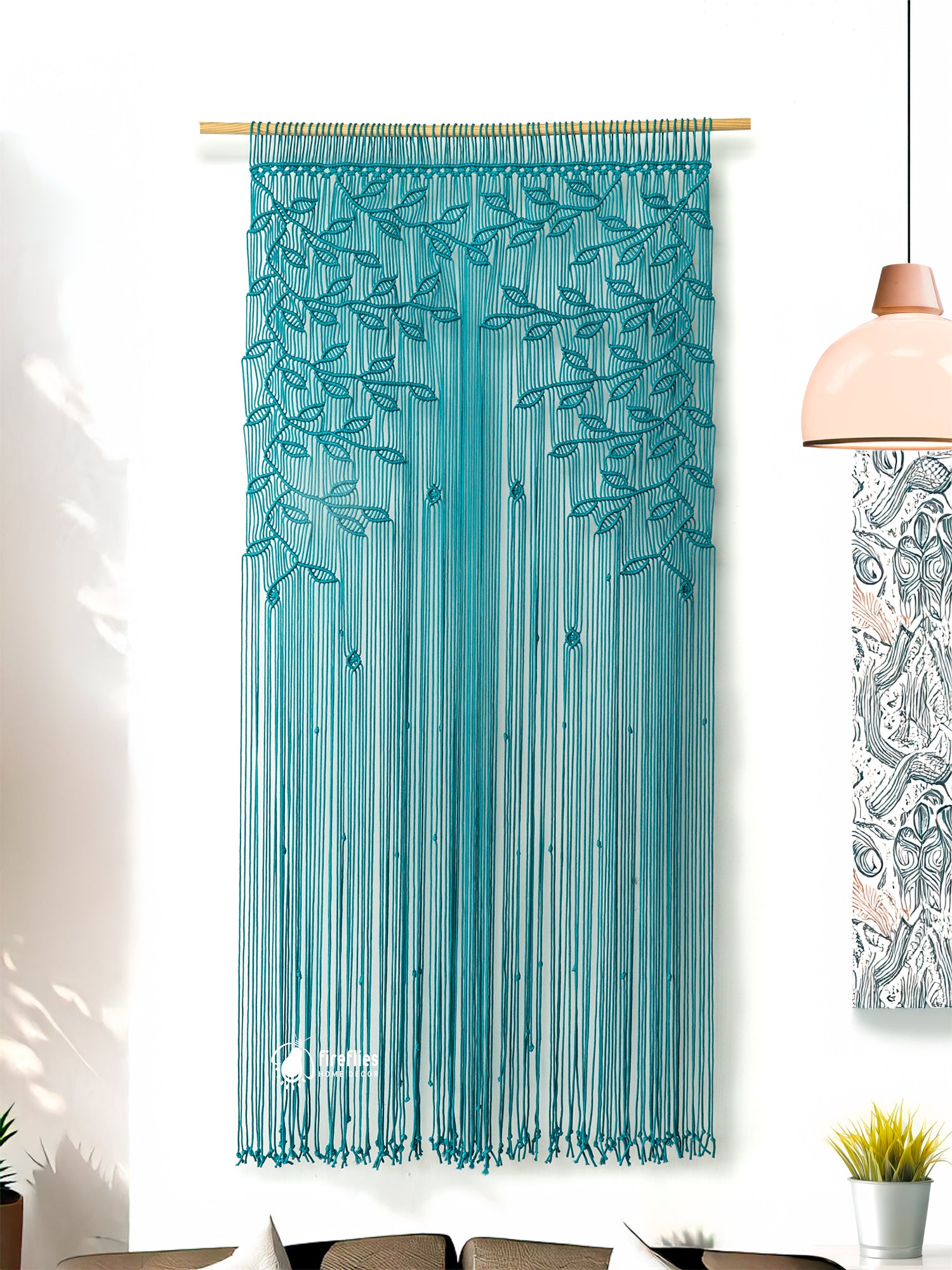Teal string curtain with leaf pattern in a room setting