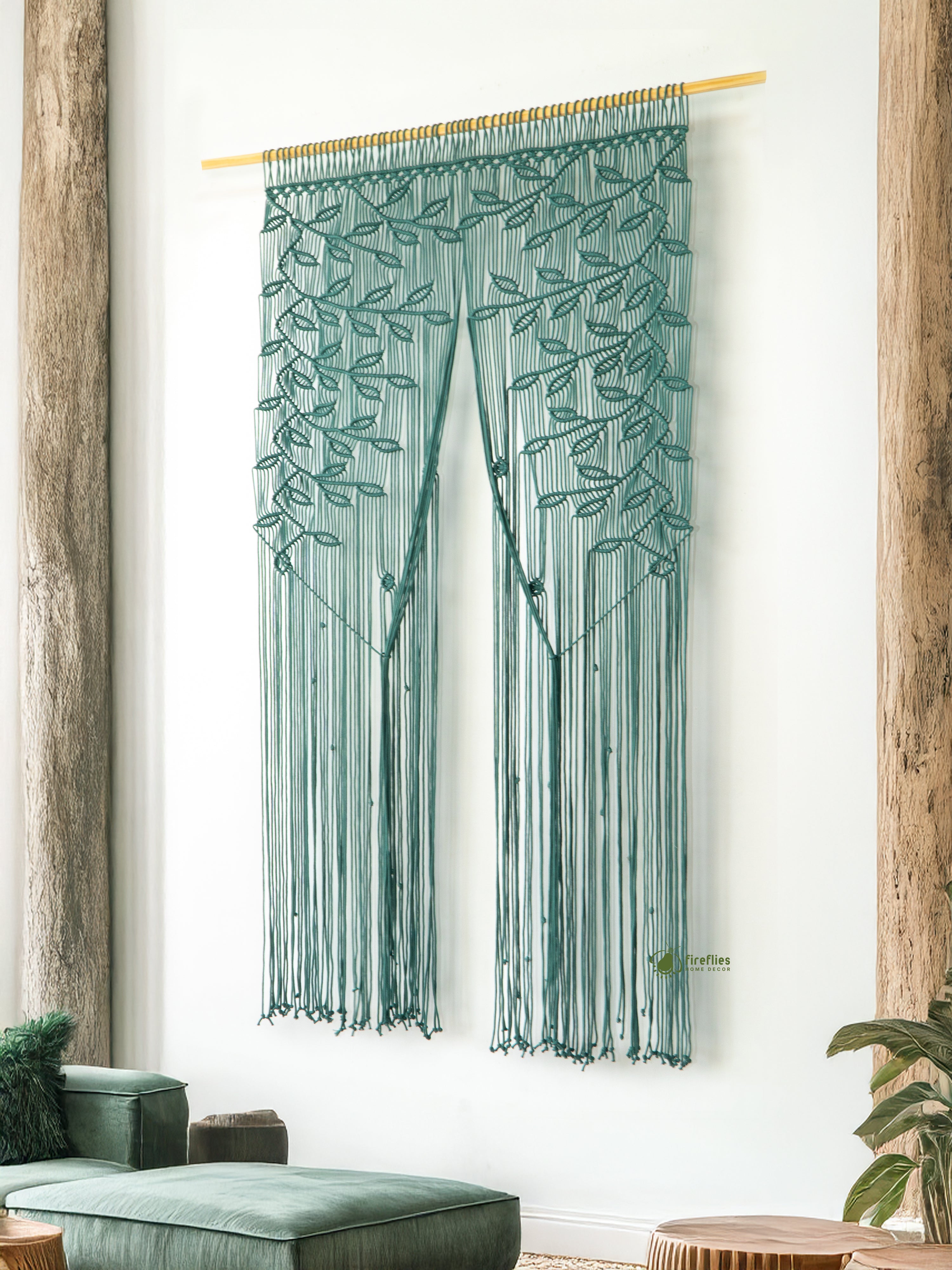 Textile art piece with leaf pattern hanging on a wall
