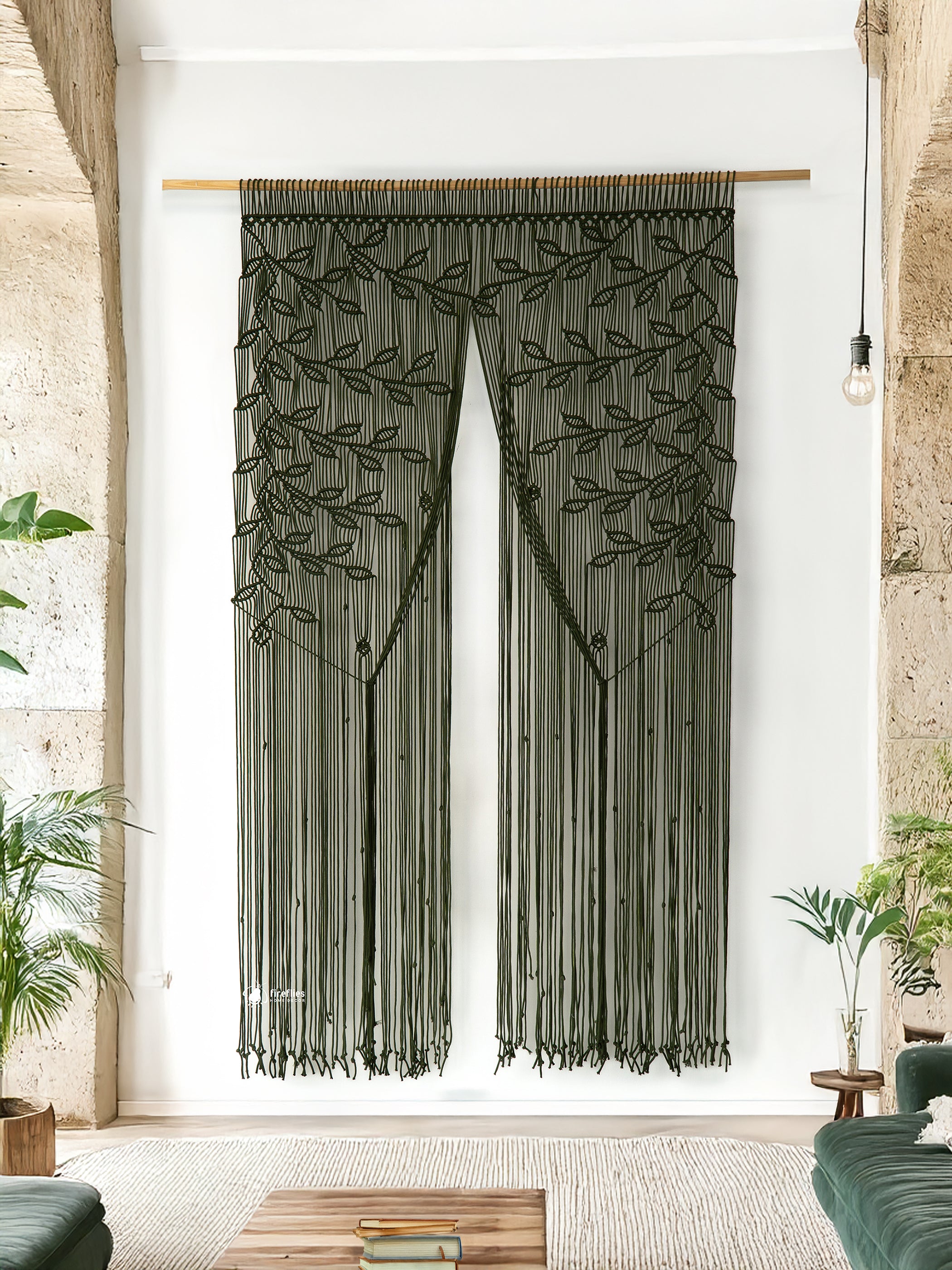 Decorative curtain with leaf pattern in a room with plants and furniture.