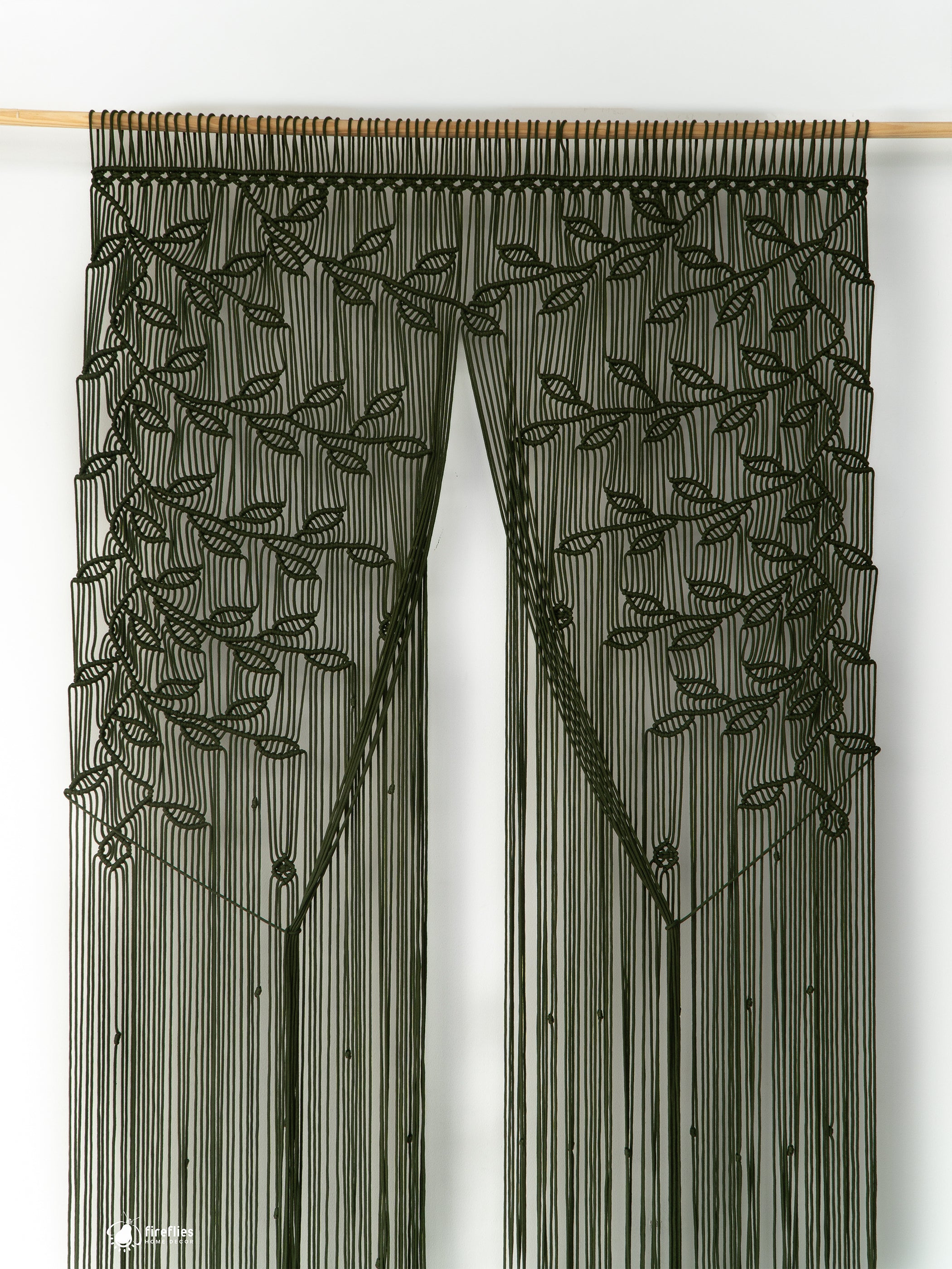 Decorative string curtain with leaf pattern on a white background