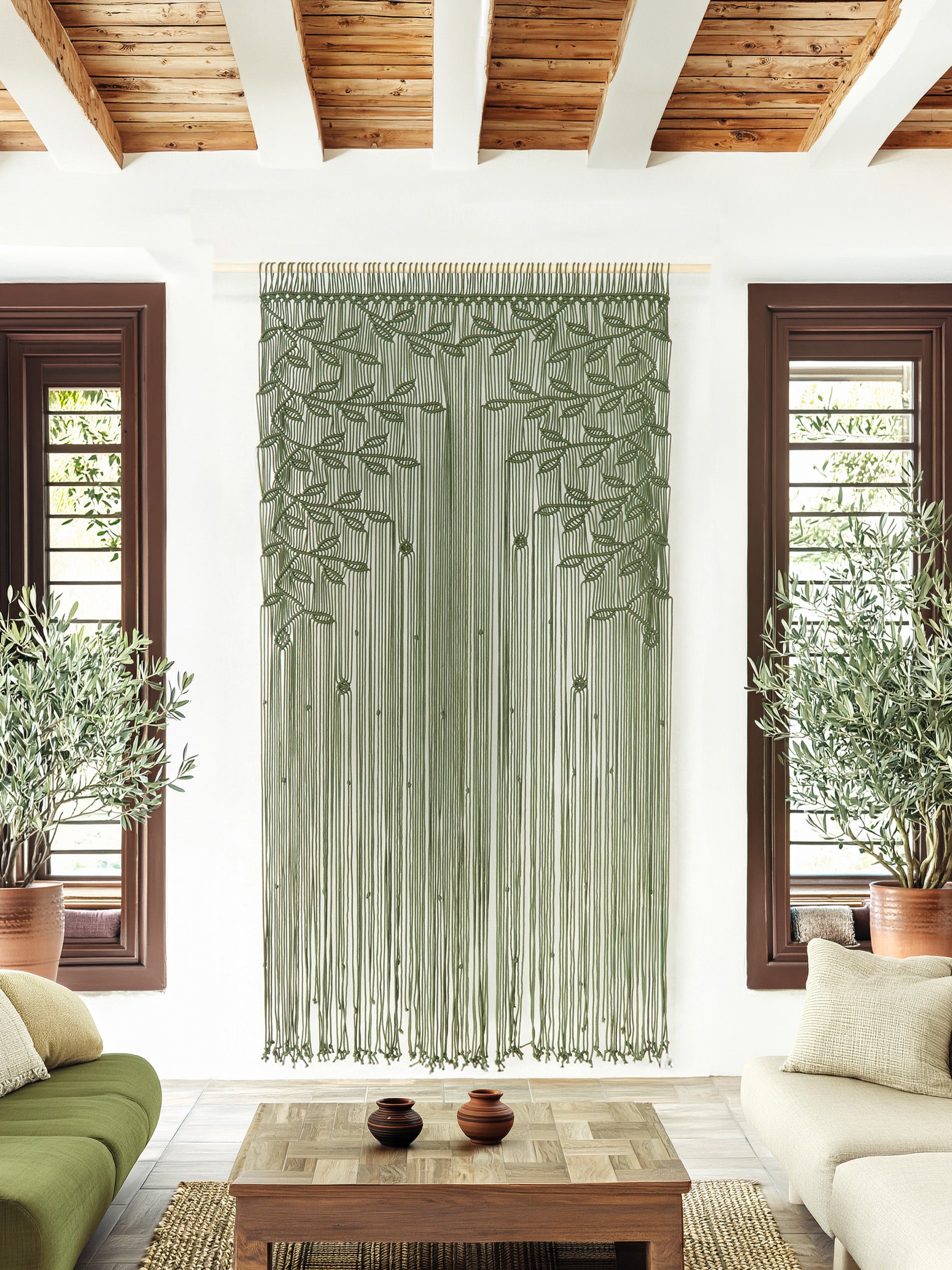 Decorative green curtain hanging in a room with wooden ceiling and white walls.