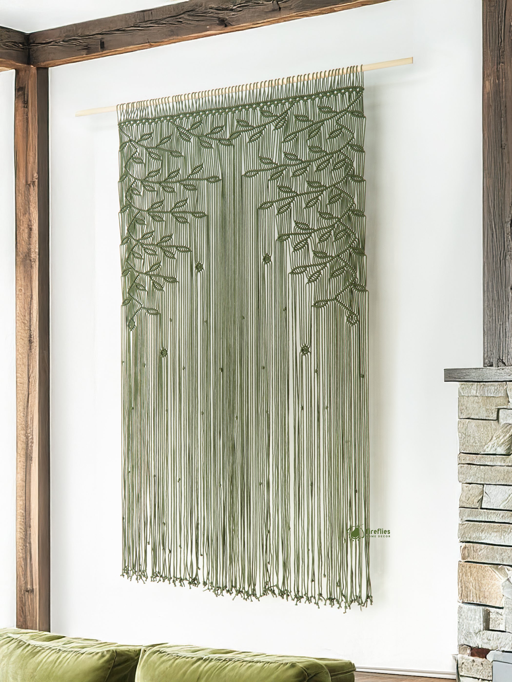 Decorative green curtain with leaf pattern hanging on a wooden frame.