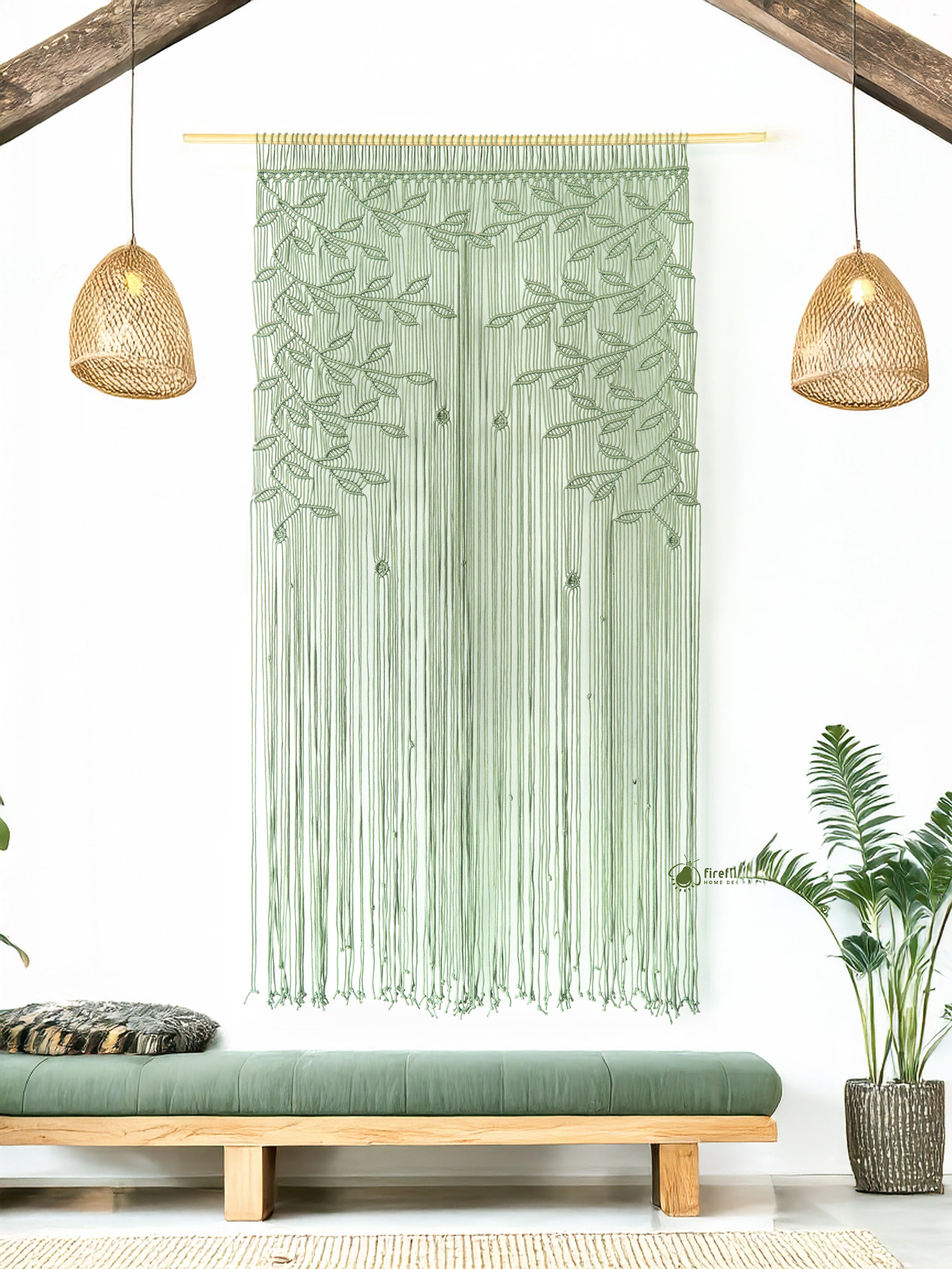 Green woven wall hanging in a room with wooden bench and plants