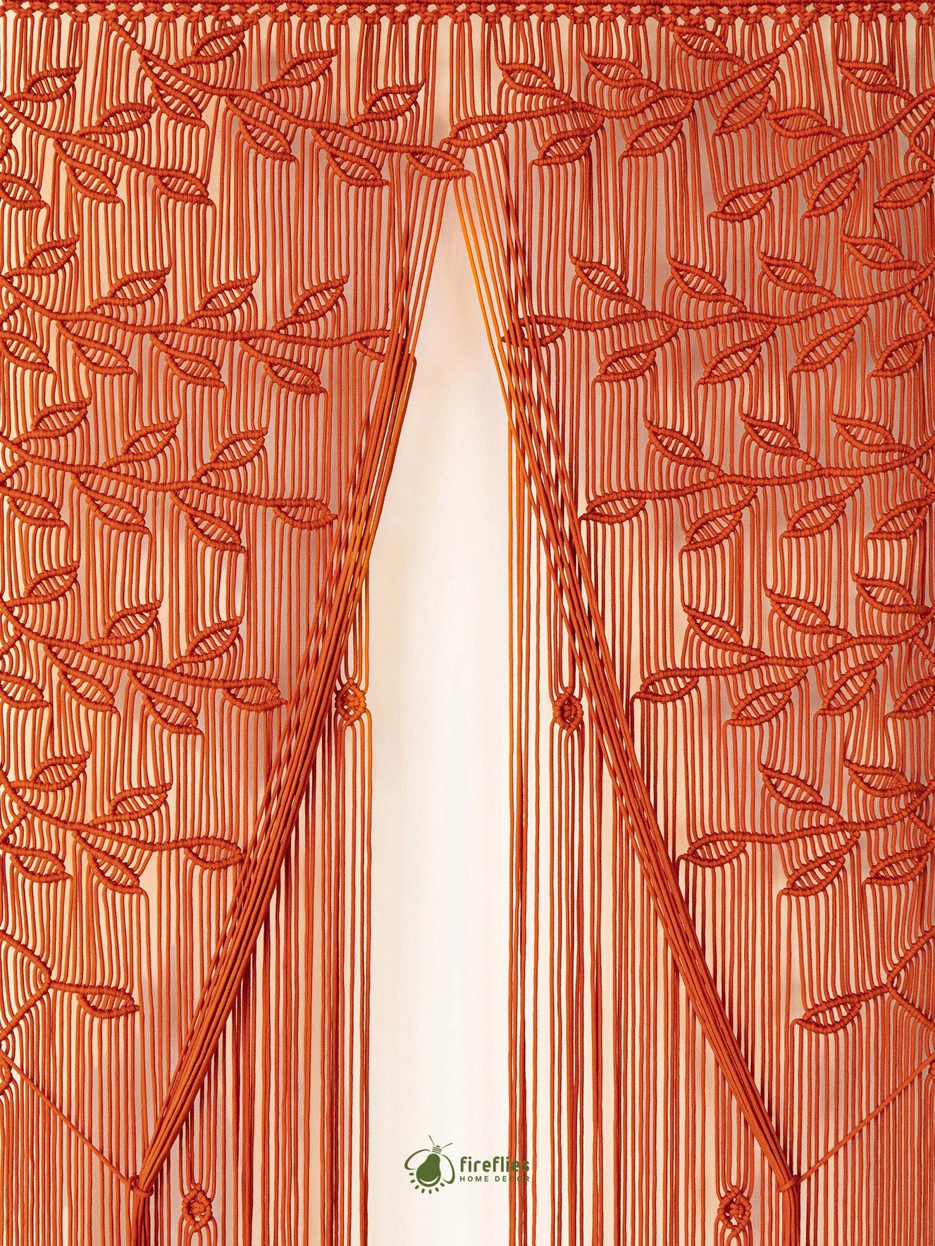 A purple embroidered bunting curtain with leaf and vine patterns and hanging fringe, shown hanging against a white background.