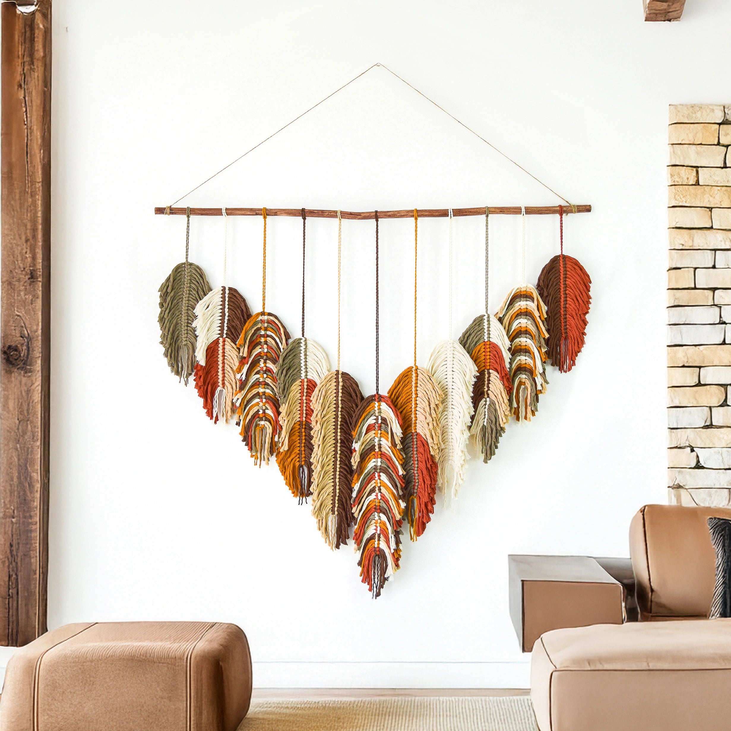 Colorful woven wall art hanging in a room with a chair and couch.