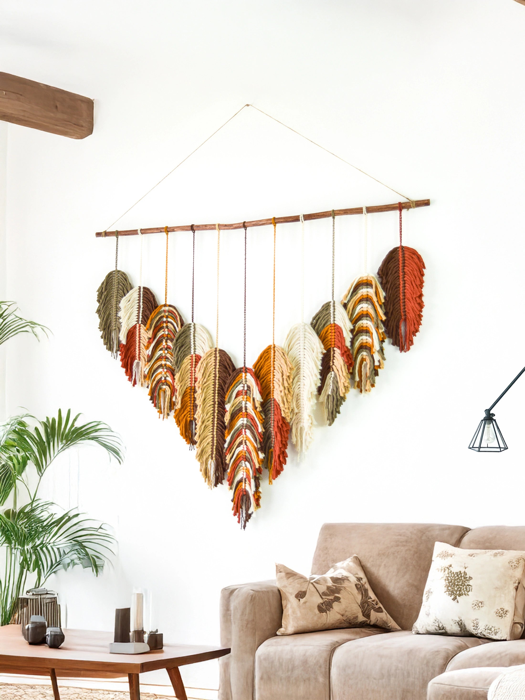 Colorful feather wall hanging in a living room setting