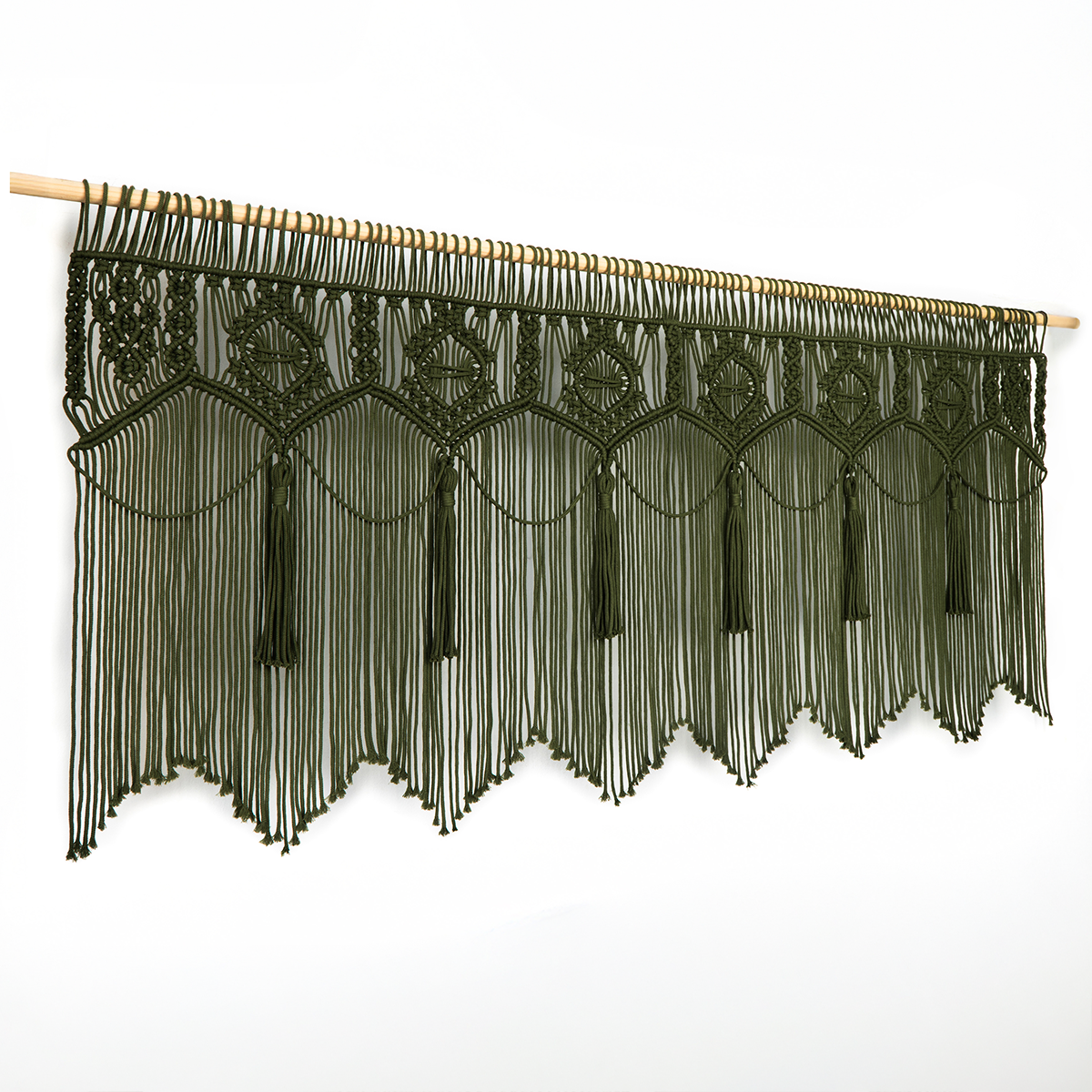 Decorative black macrame wall hanging with geometric patterns on a white background