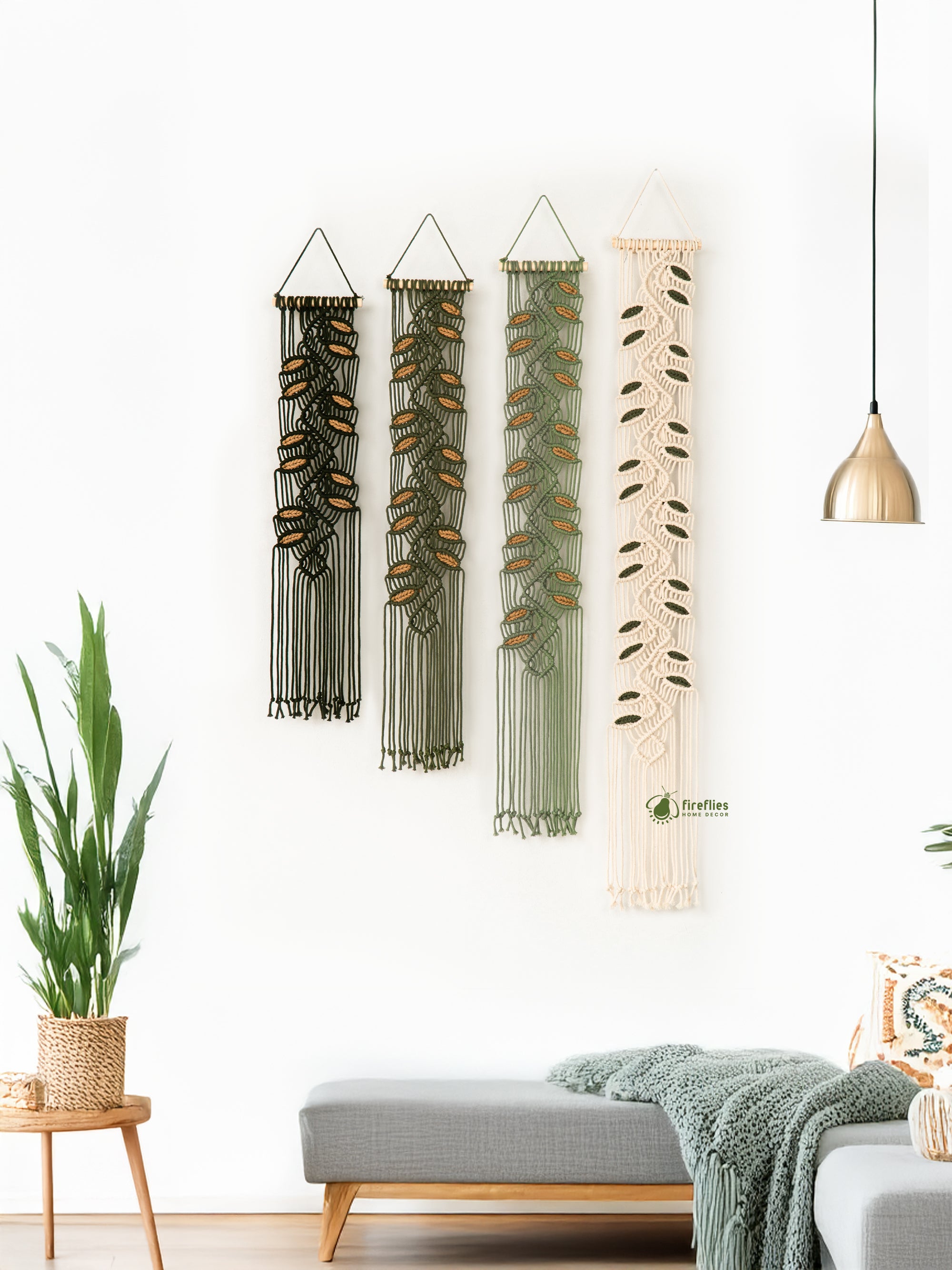 Textile wall hanging with fringe on a white wall, with a chair and cabinet in the foreground.